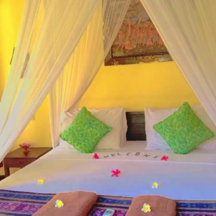 Bed in Tirta Sari Bungalow