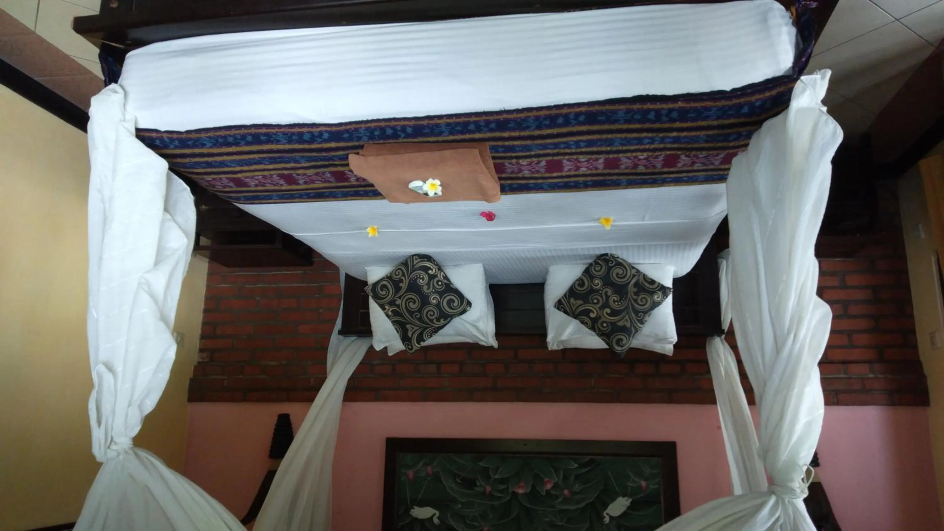 Bed in Tirta Sari Bungalow