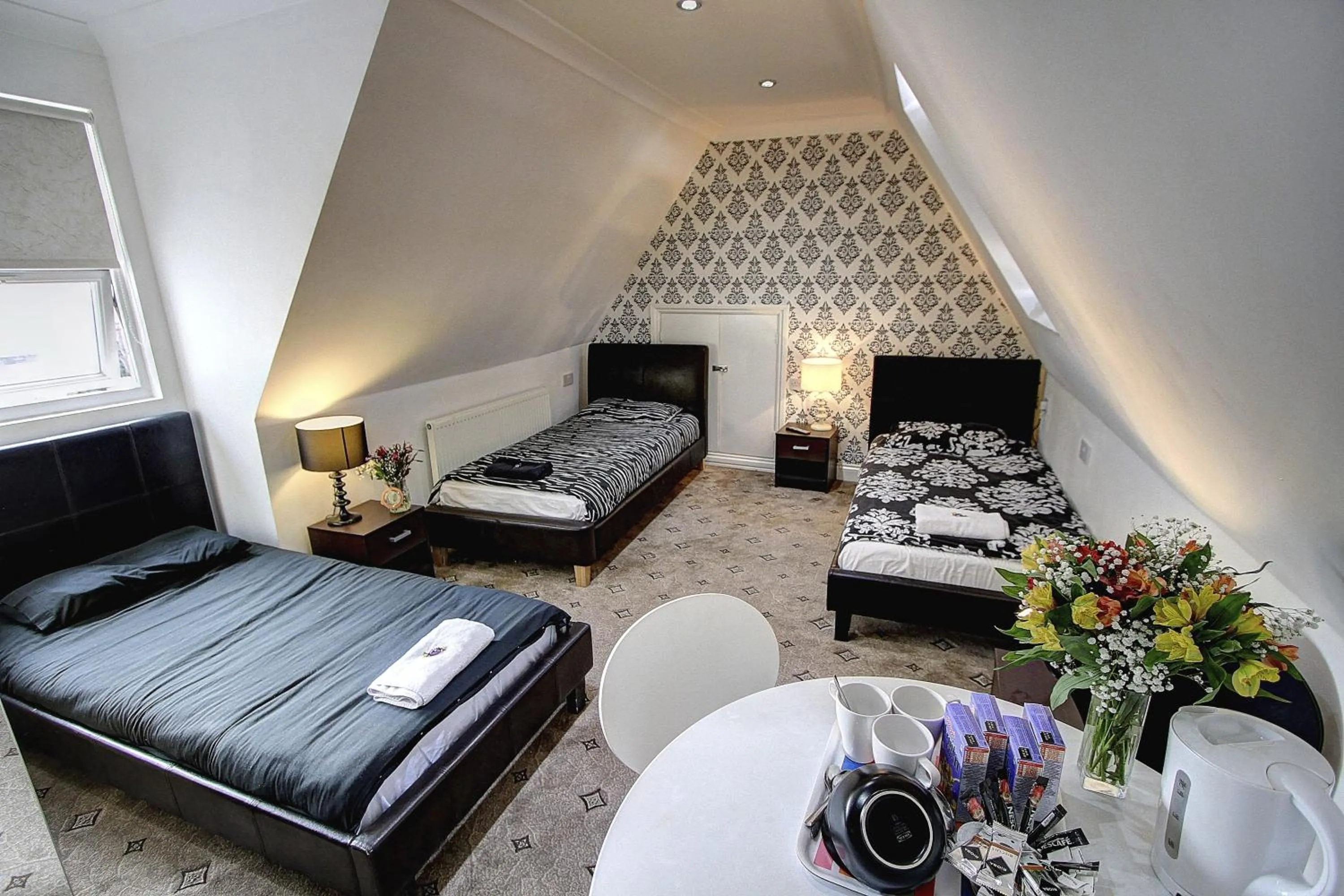 Photo of the whole room, Bed in Beaconsfield Hotel