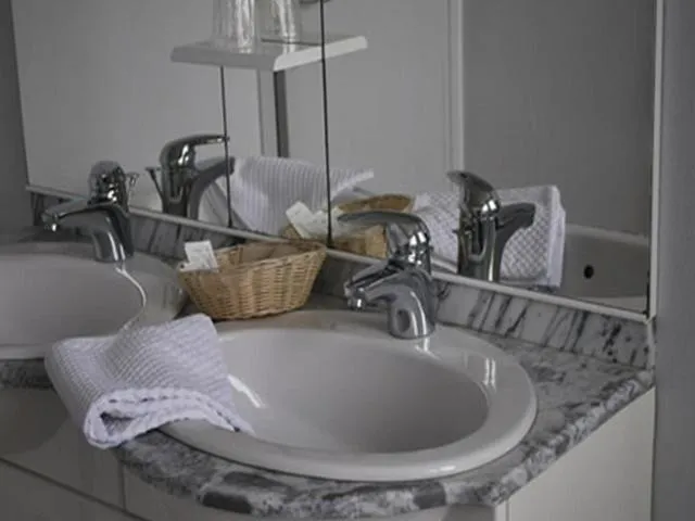 Bathroom in Logis Hôtel & Restaurant - Le Normandie
