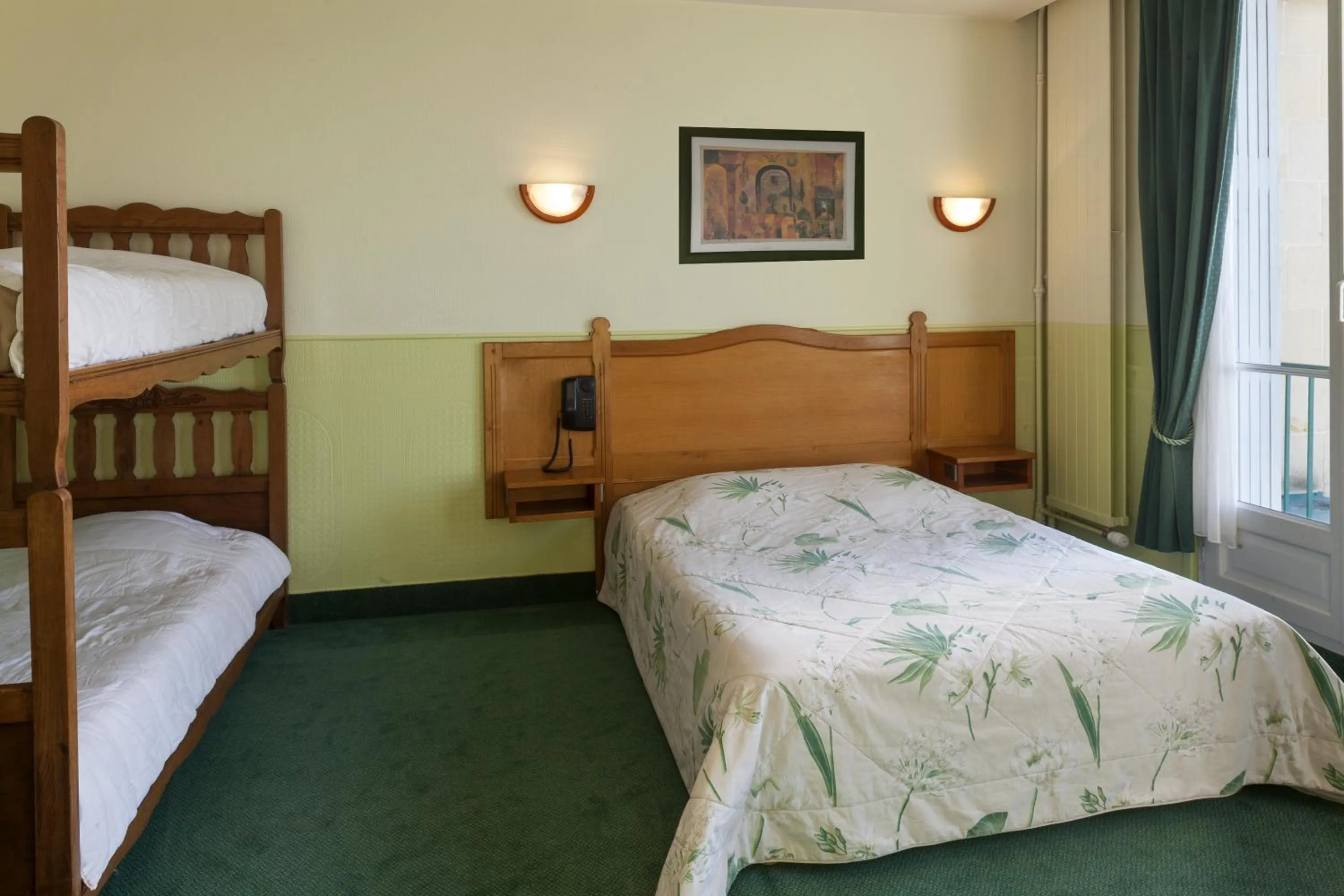 Bedroom in Logis Hôtel & Restaurant - Le Normandie