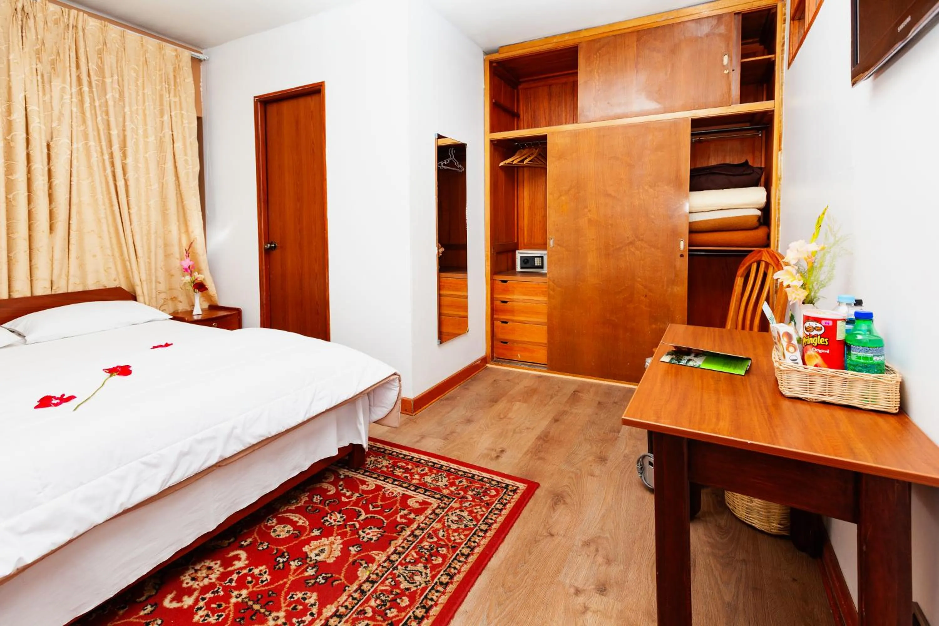 Bed in Hotel Sol del Oriente Cusco