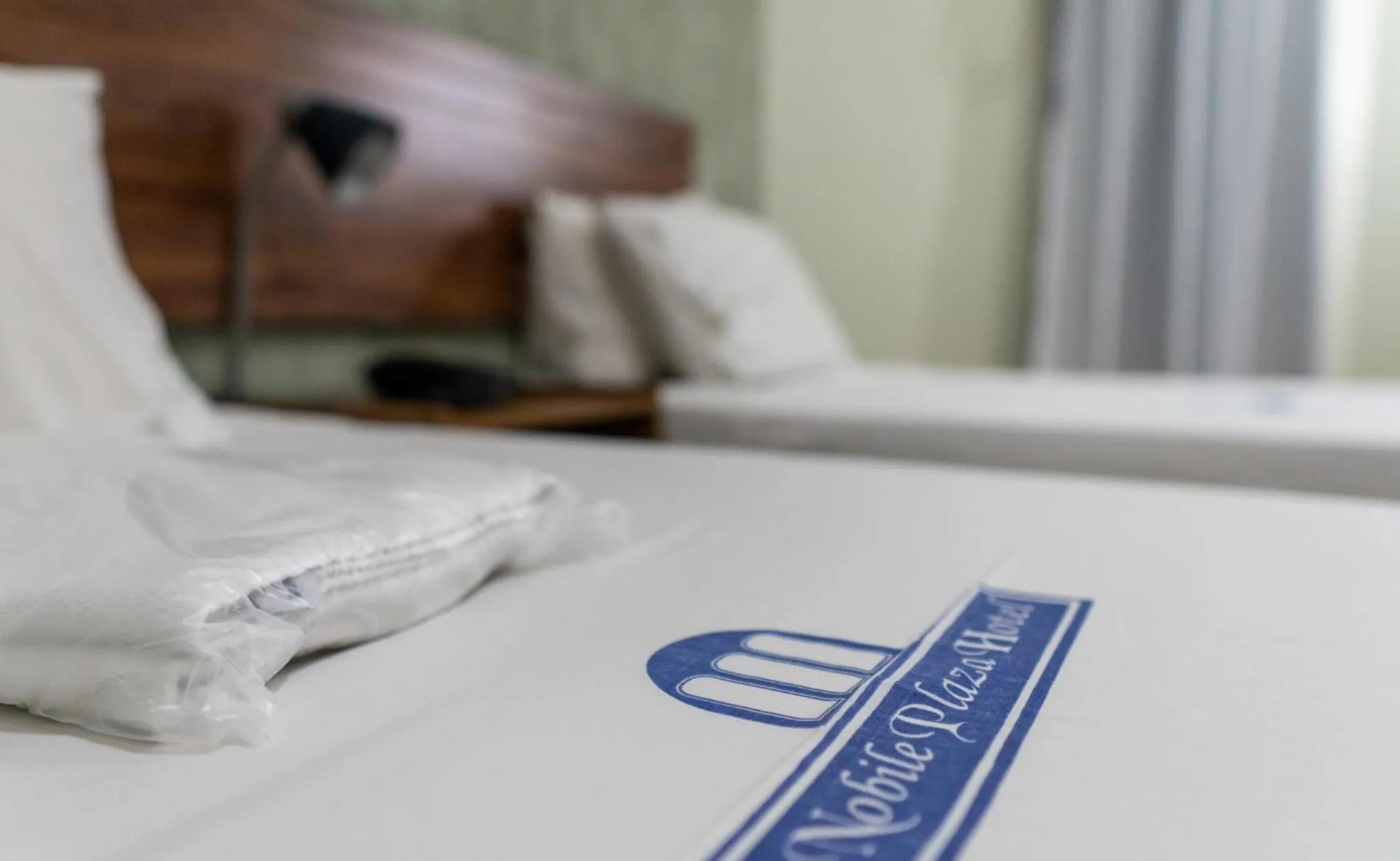 Bed in Nobile Plaza Hotel