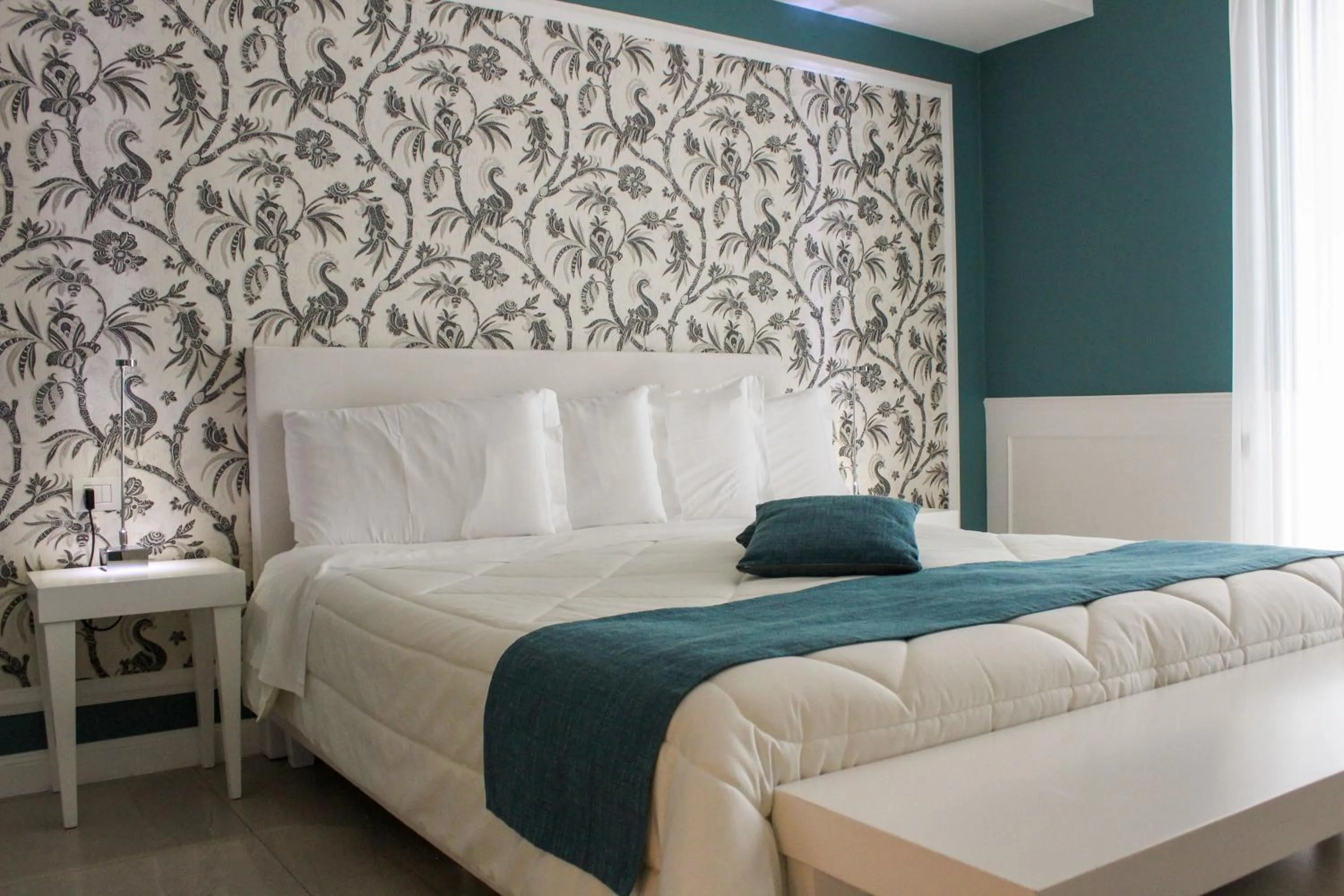 Bed in Bianco Riccio Suite Hotel