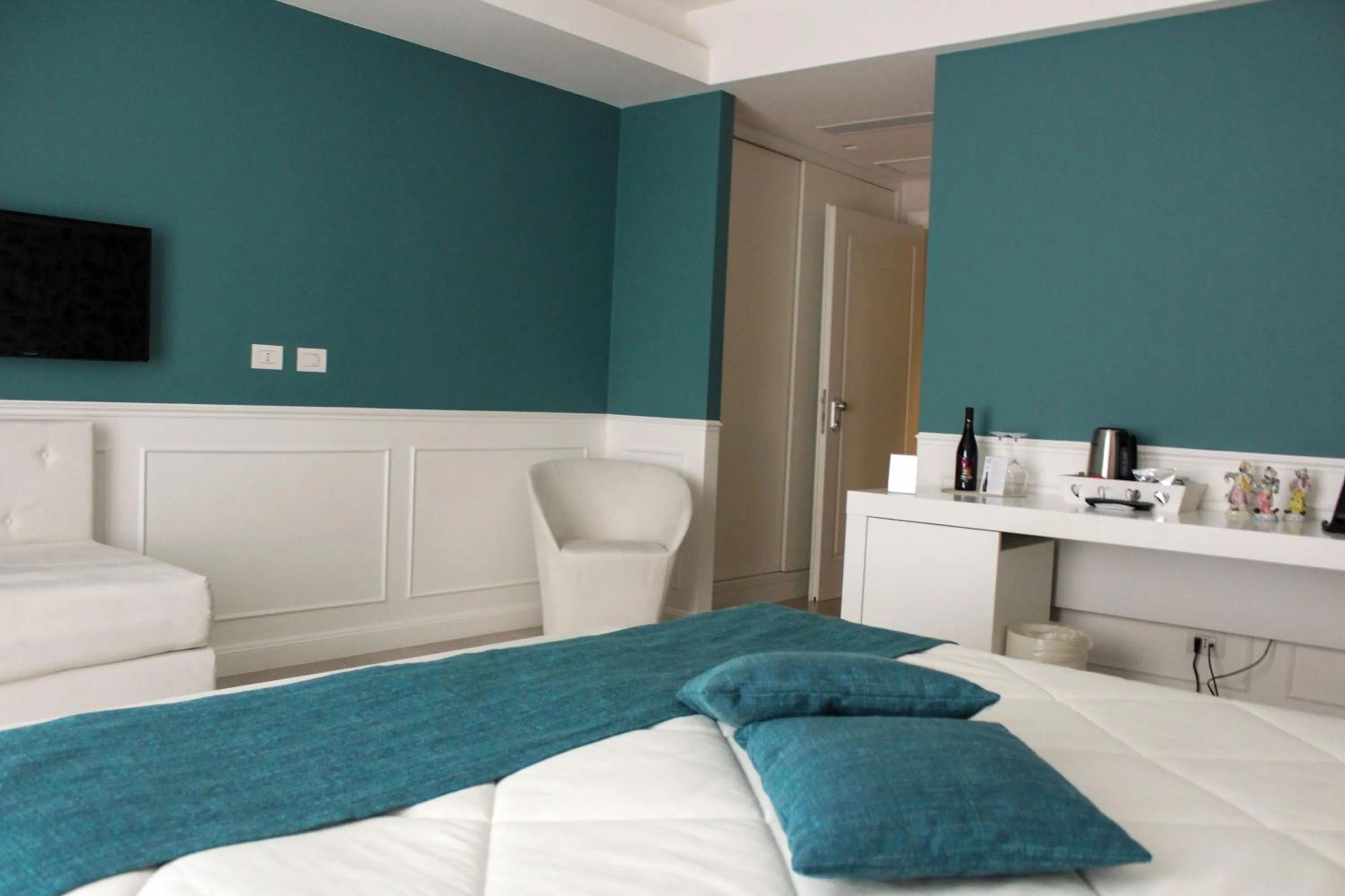 Bed in Bianco Riccio Suite Hotel