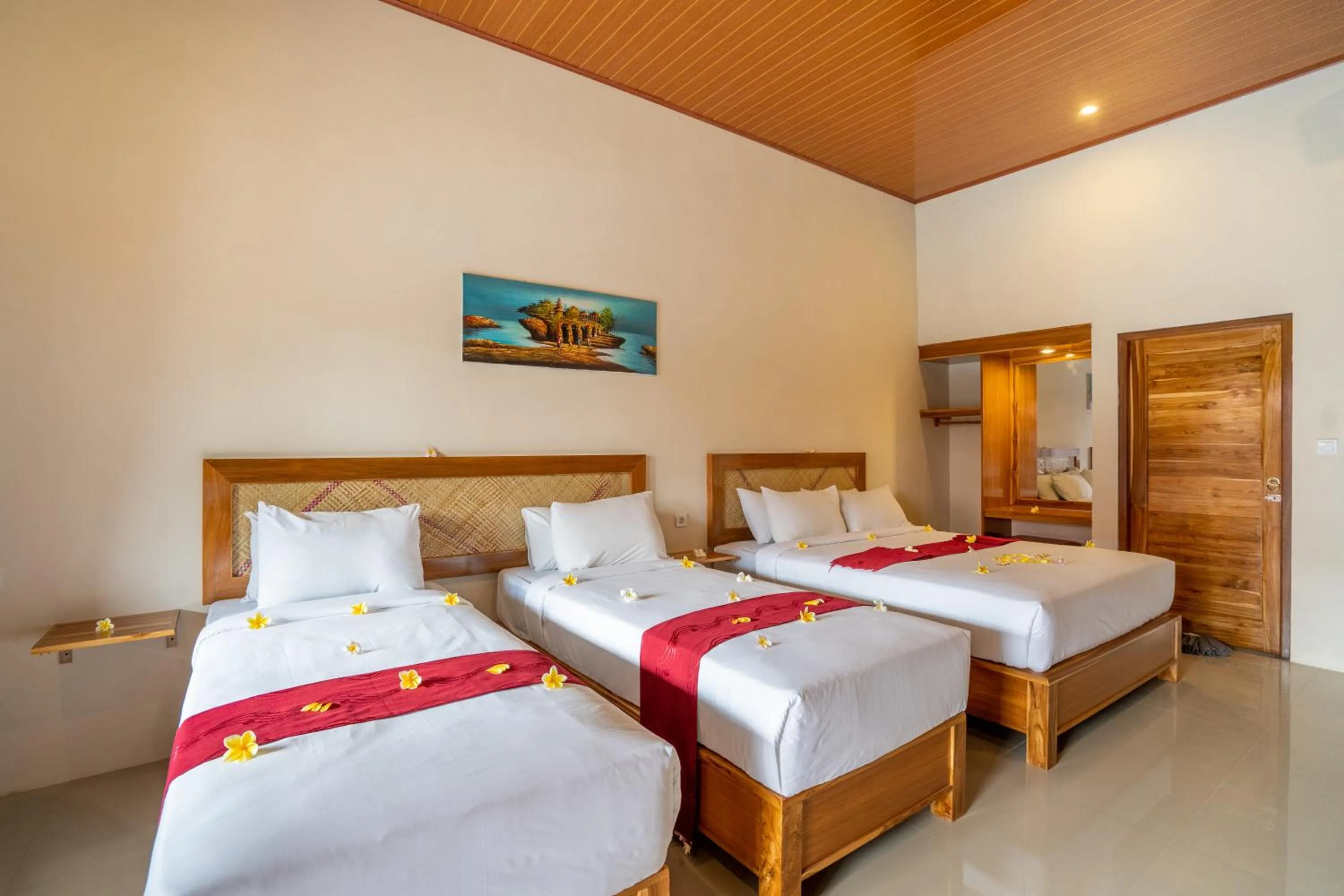 Bed in Kubuku Eco Dive Lodge and Yoga