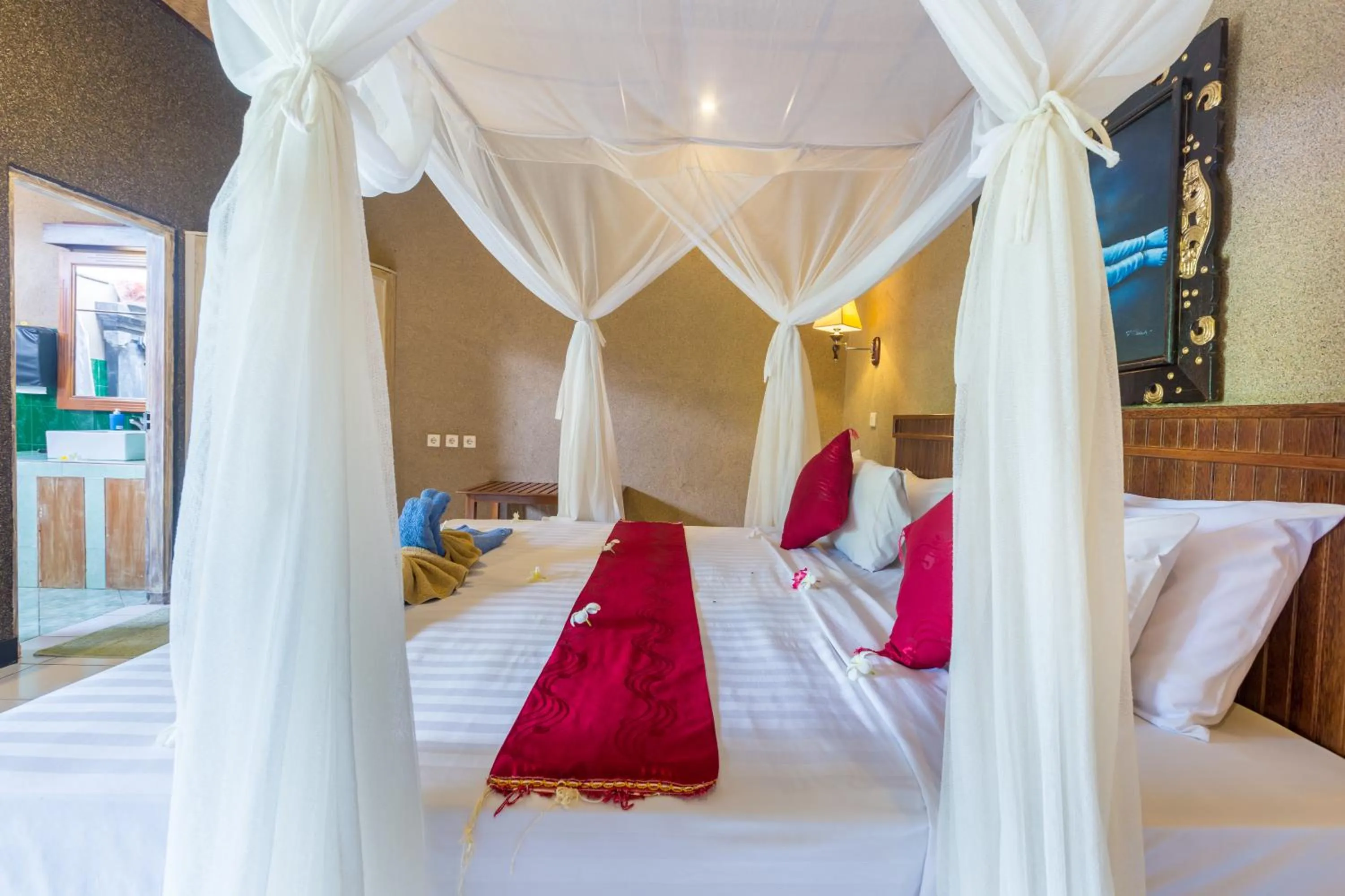 Bed in Kubuku Eco Dive Lodge and Yoga