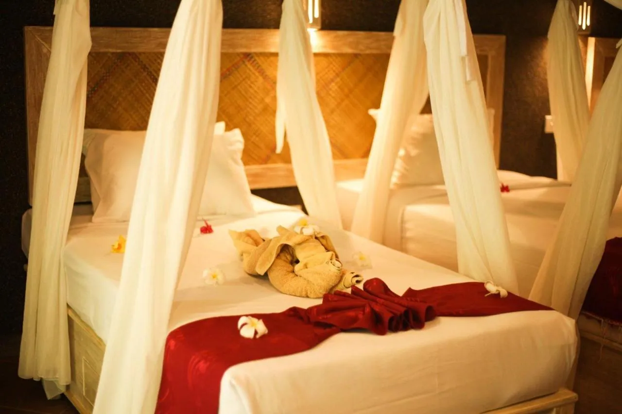 Bed in Kubuku Eco Dive Lodge and Yoga