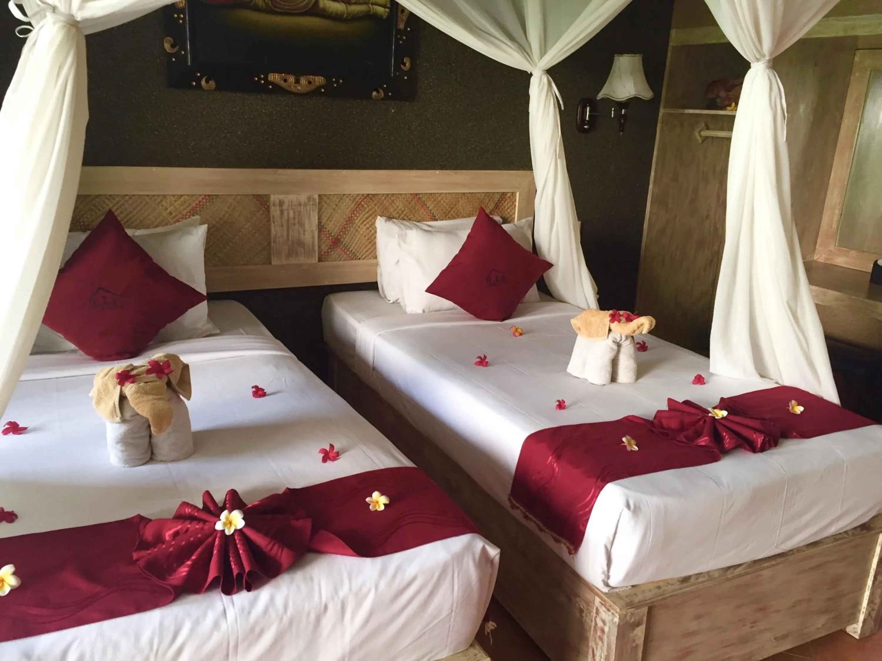 Bed in Kubuku Eco Dive Lodge and Yoga