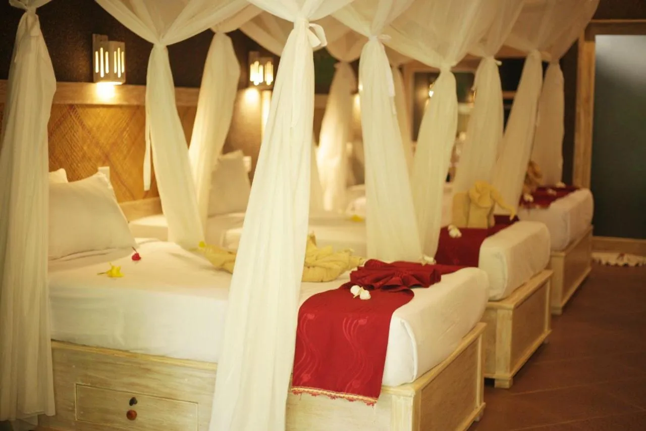 Bed in Kubuku Eco Dive Lodge and Yoga