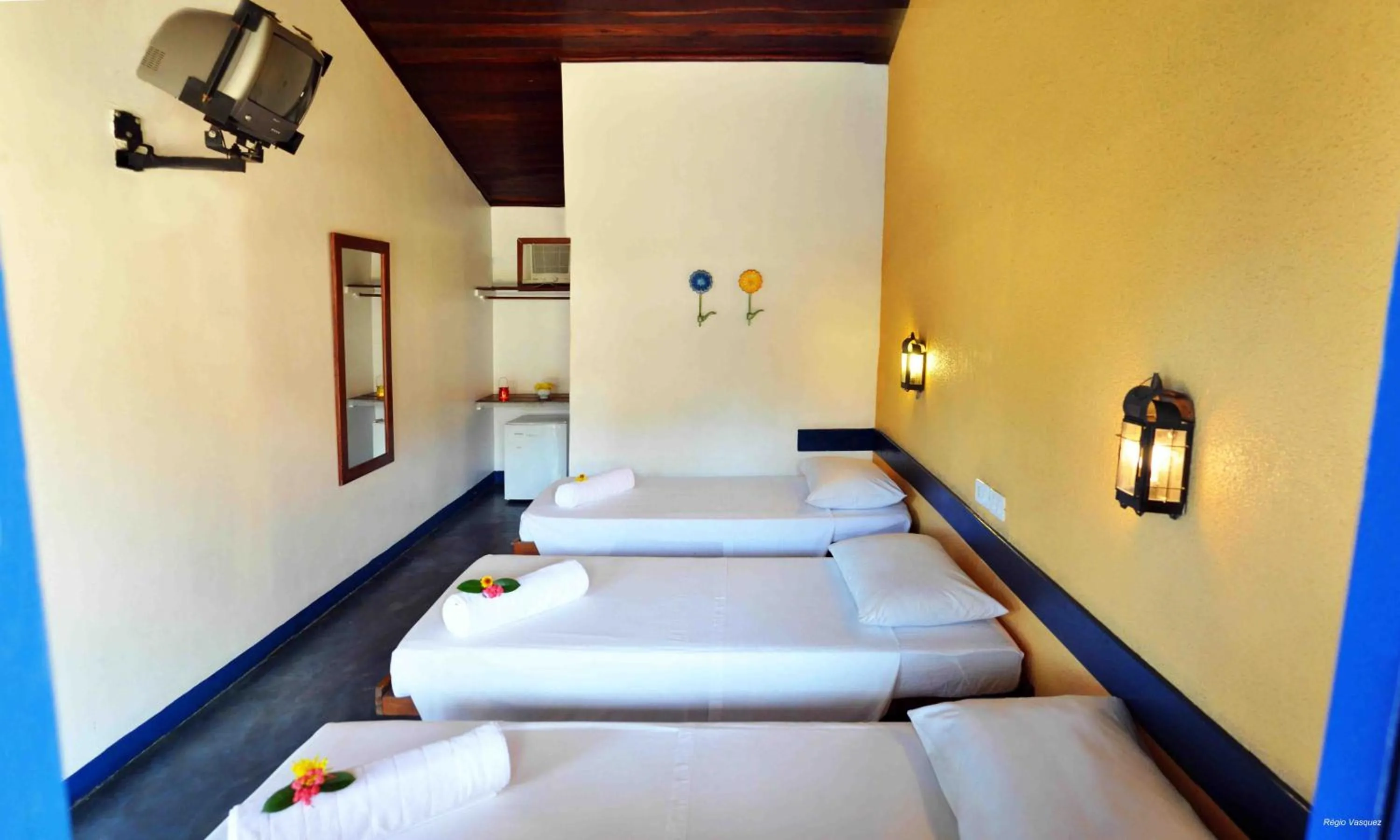 Bed in Pousada Sao Luiz