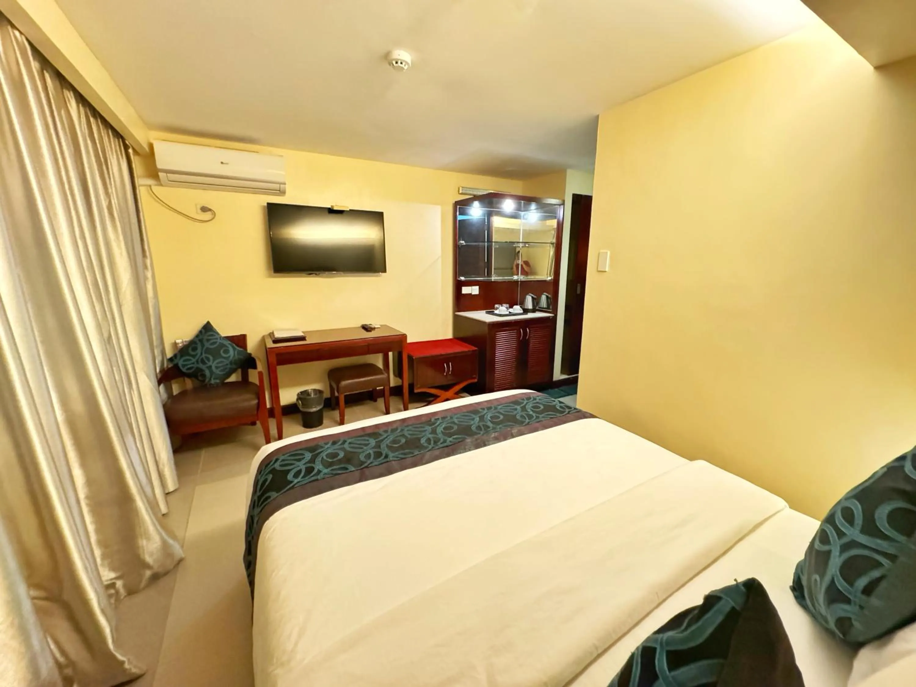 Bed in Golden Phoenix Hotel Boracay