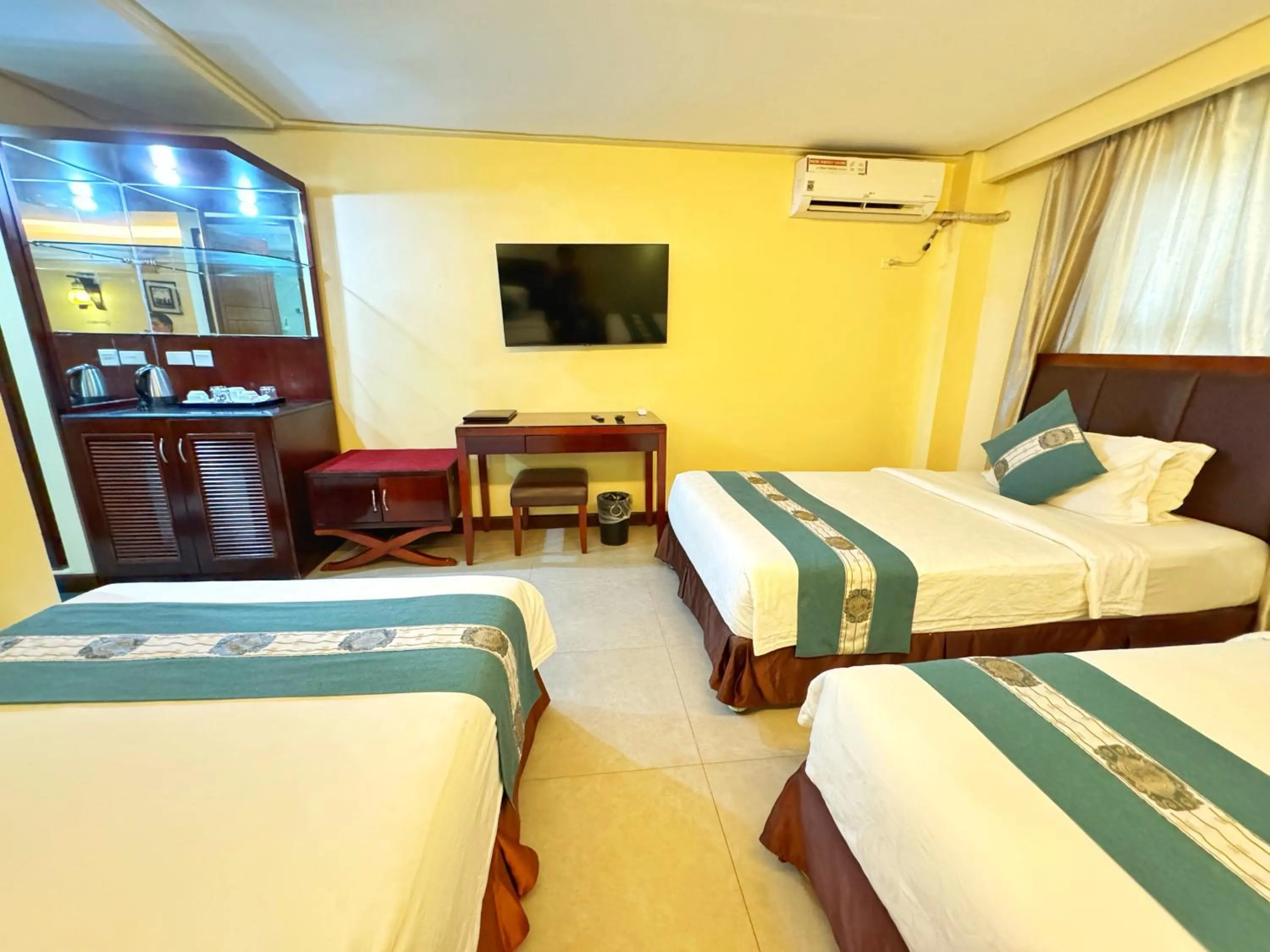 Bed in Golden Phoenix Hotel Boracay