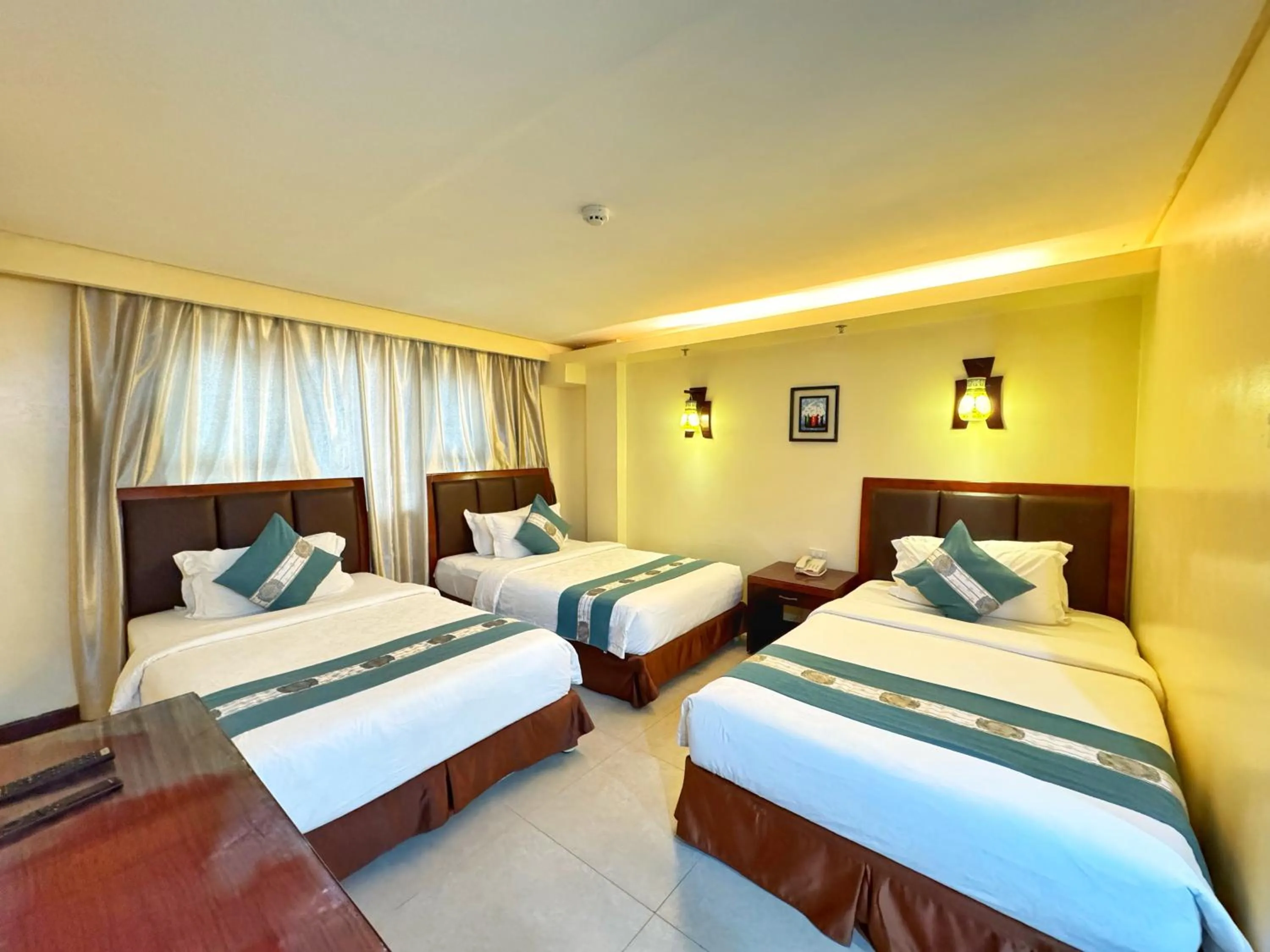 Bed in Golden Phoenix Hotel Boracay