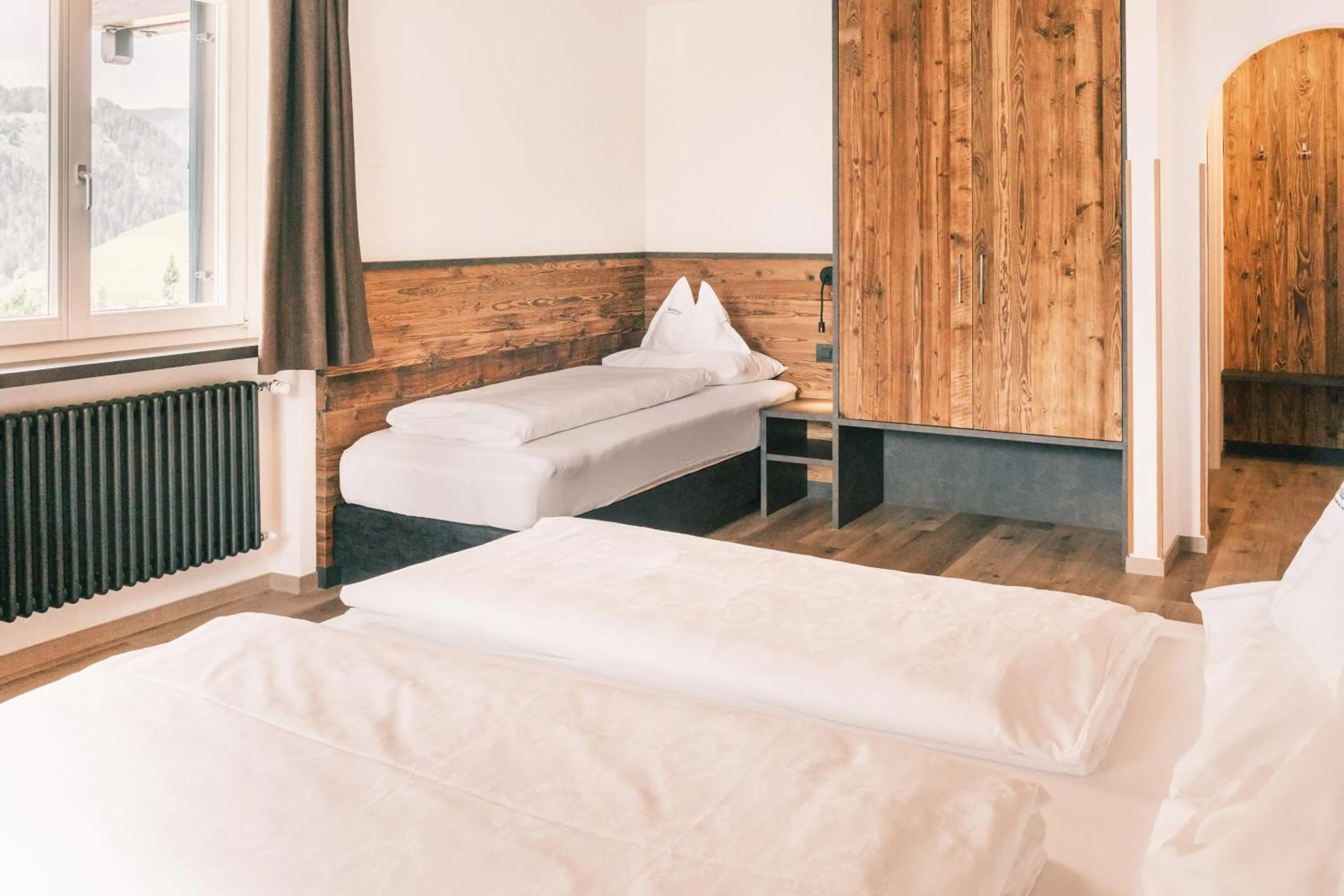 Bed in Kristiania Small Dolomites Hotel