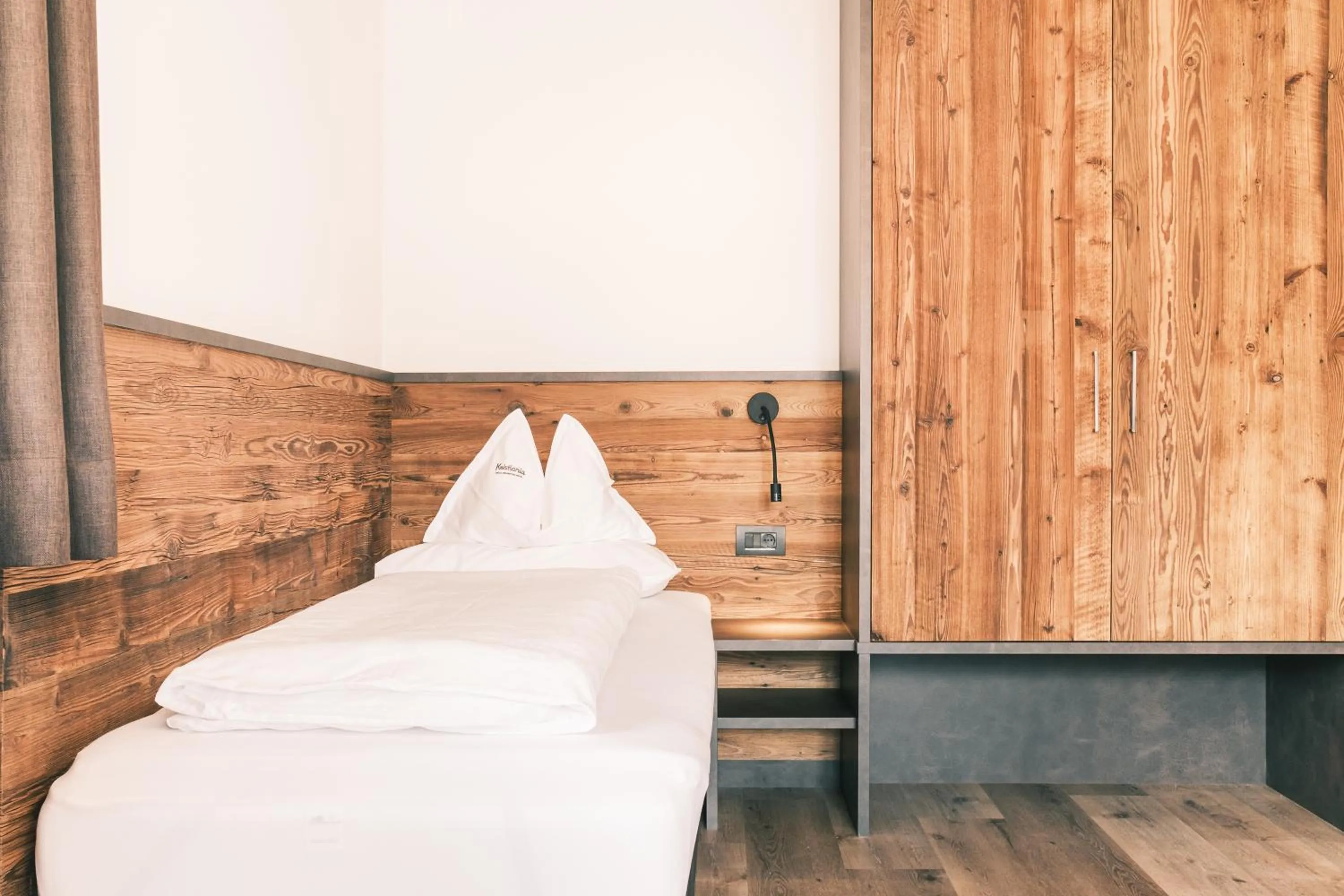 Bed in Kristiania Small Dolomites Hotel