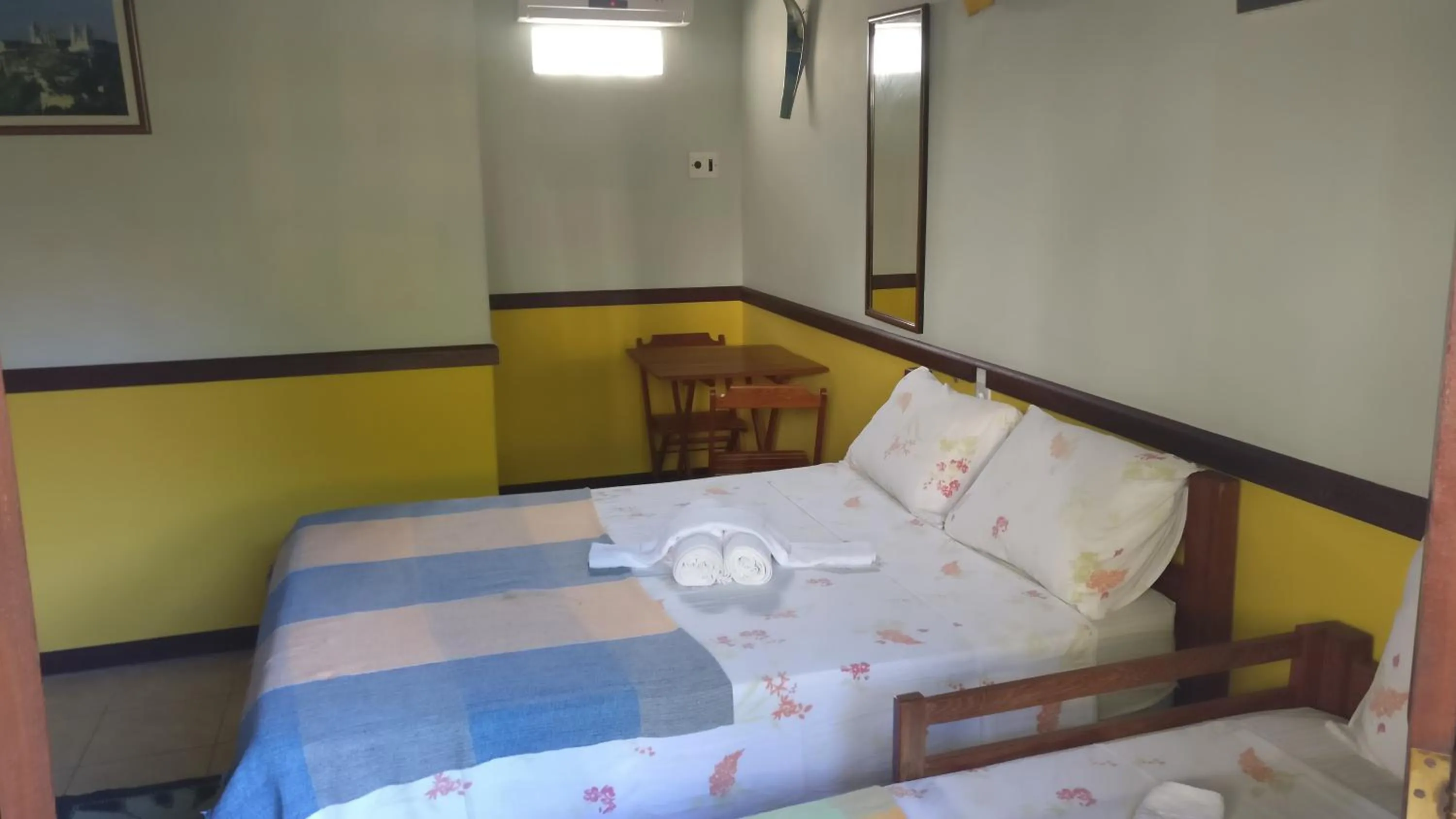 Bed in Pousada Tropicalia