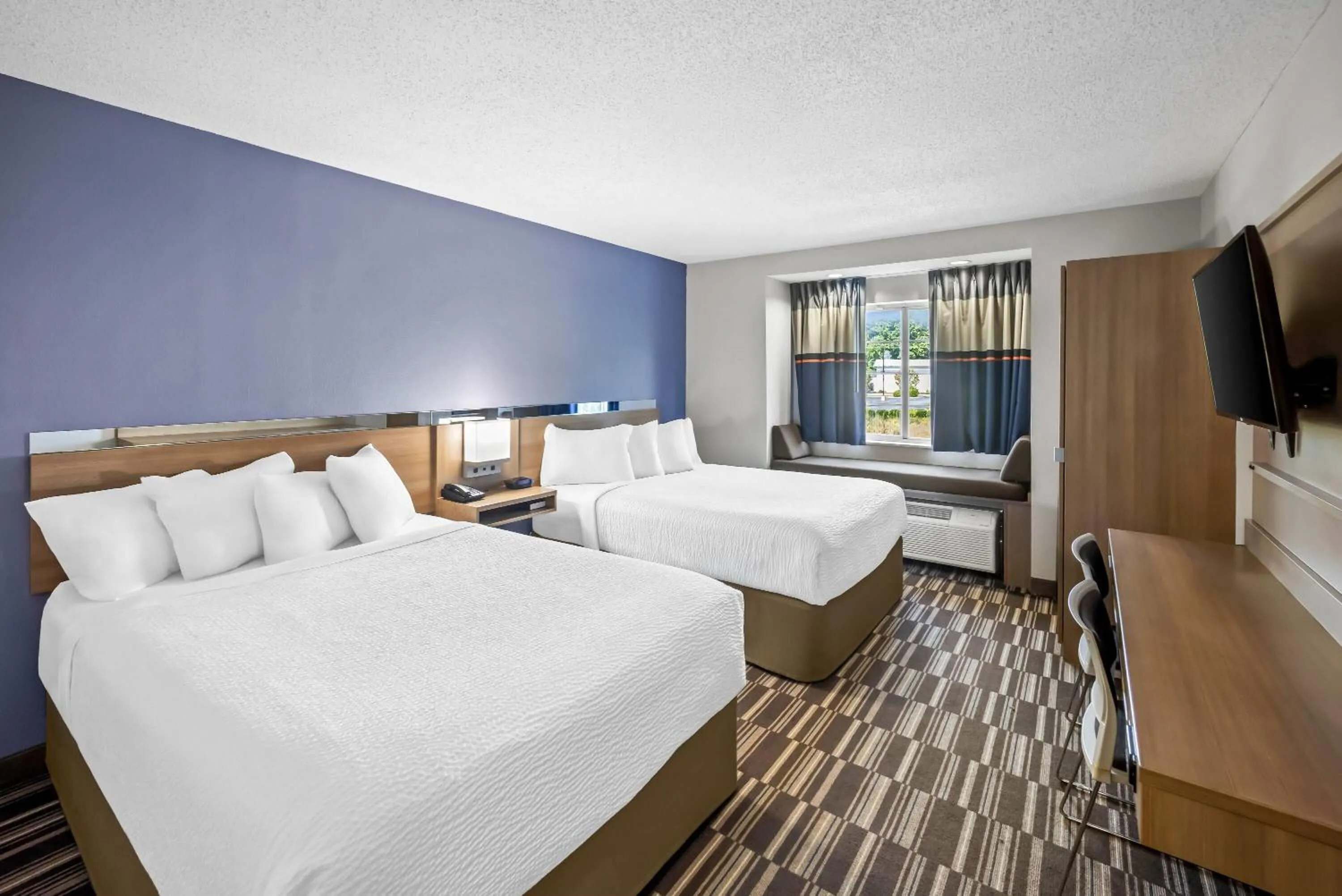 Bed in Microtel Inn by Wyndham Greensboro