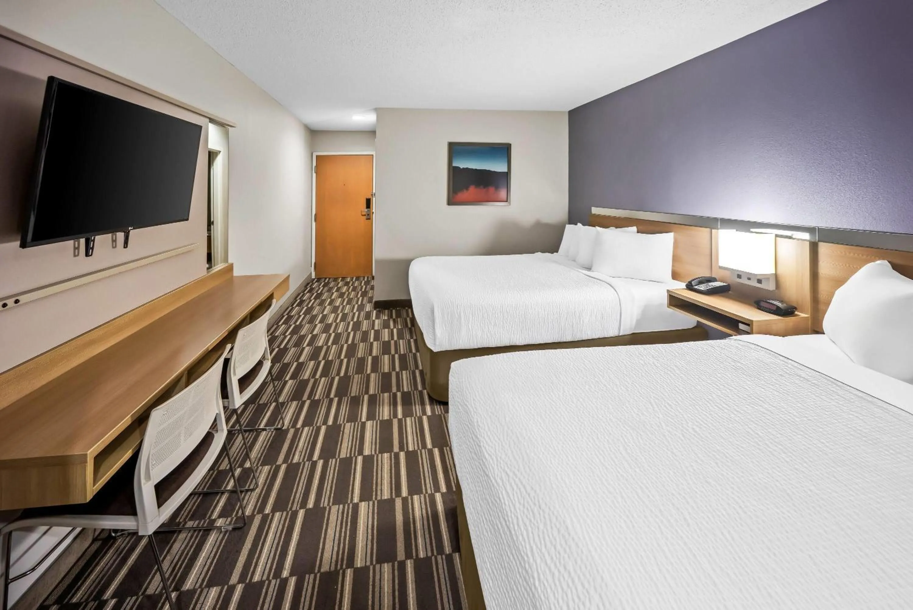 Bed in Microtel Inn by Wyndham Greensboro