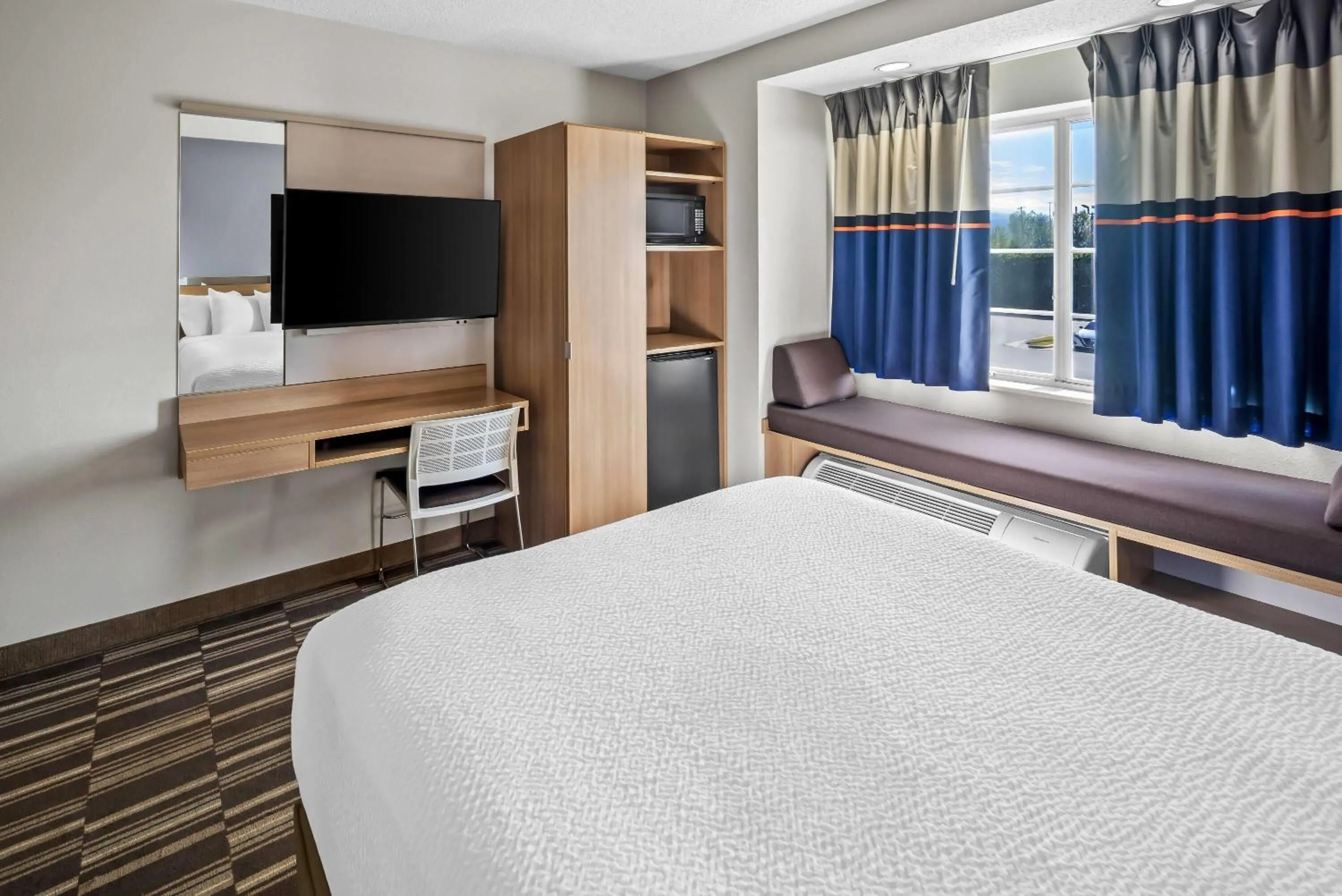 Bed in Microtel Inn by Wyndham Greensboro