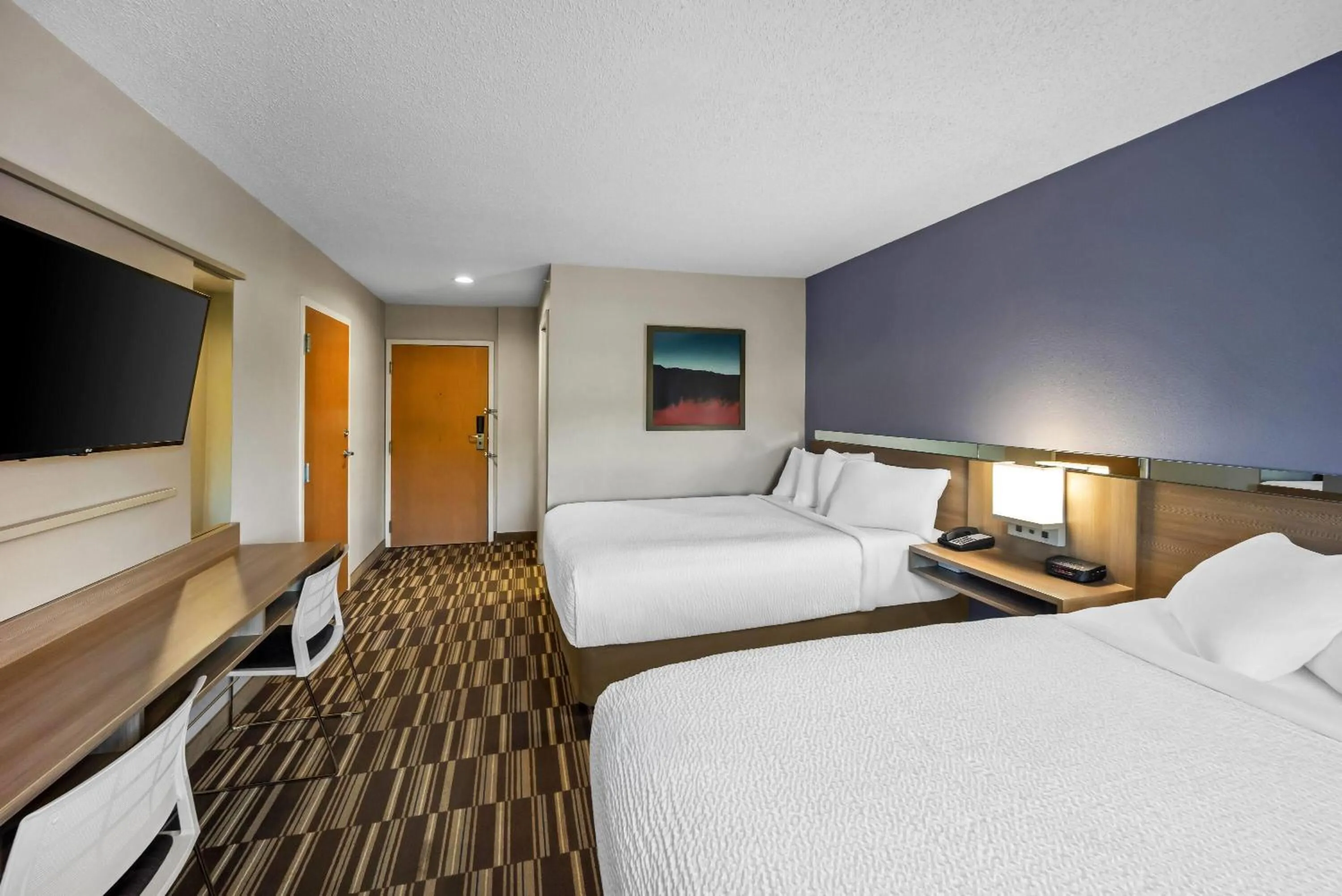 Bed in Microtel Inn by Wyndham Greensboro