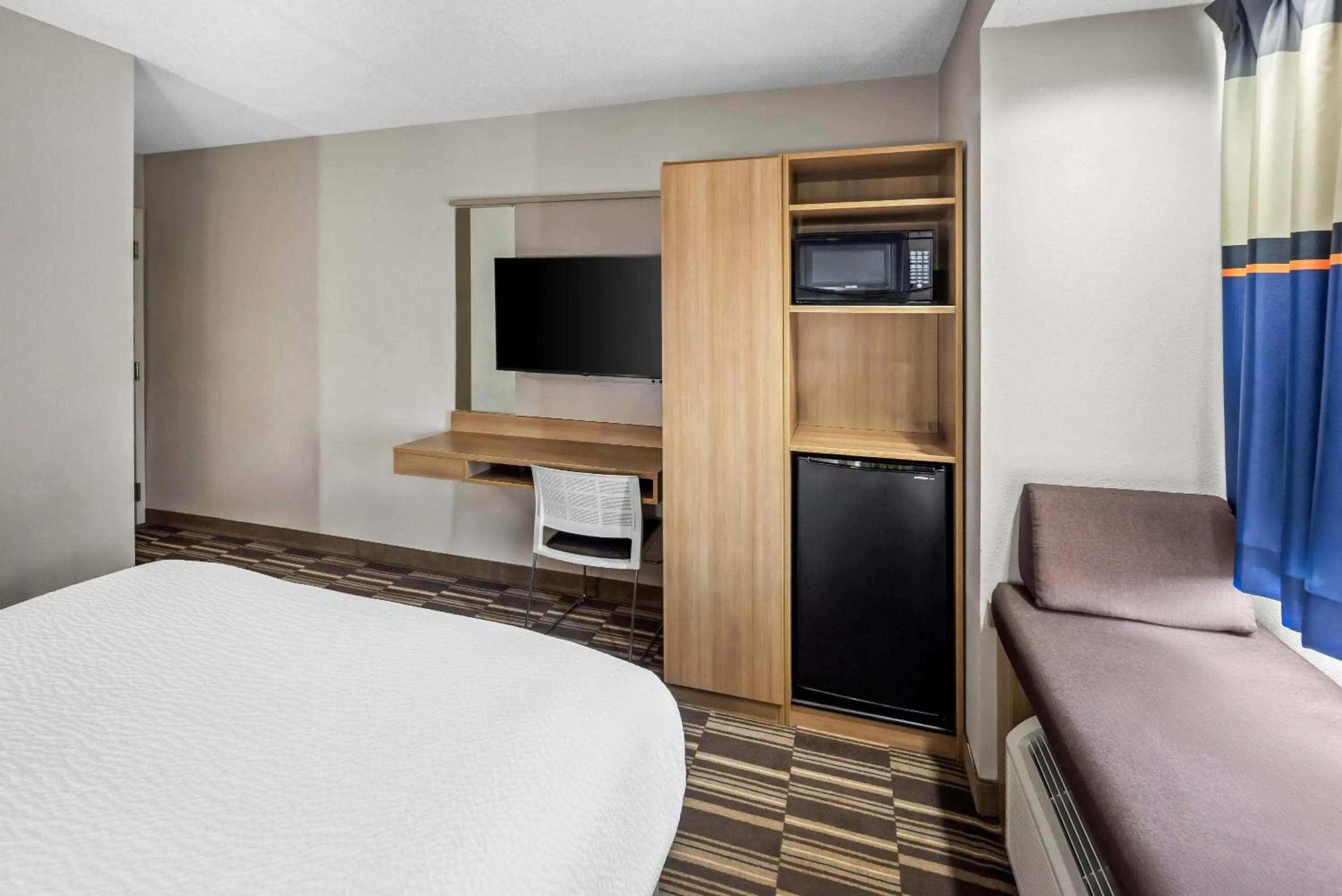 Bed in Microtel Inn by Wyndham Greensboro