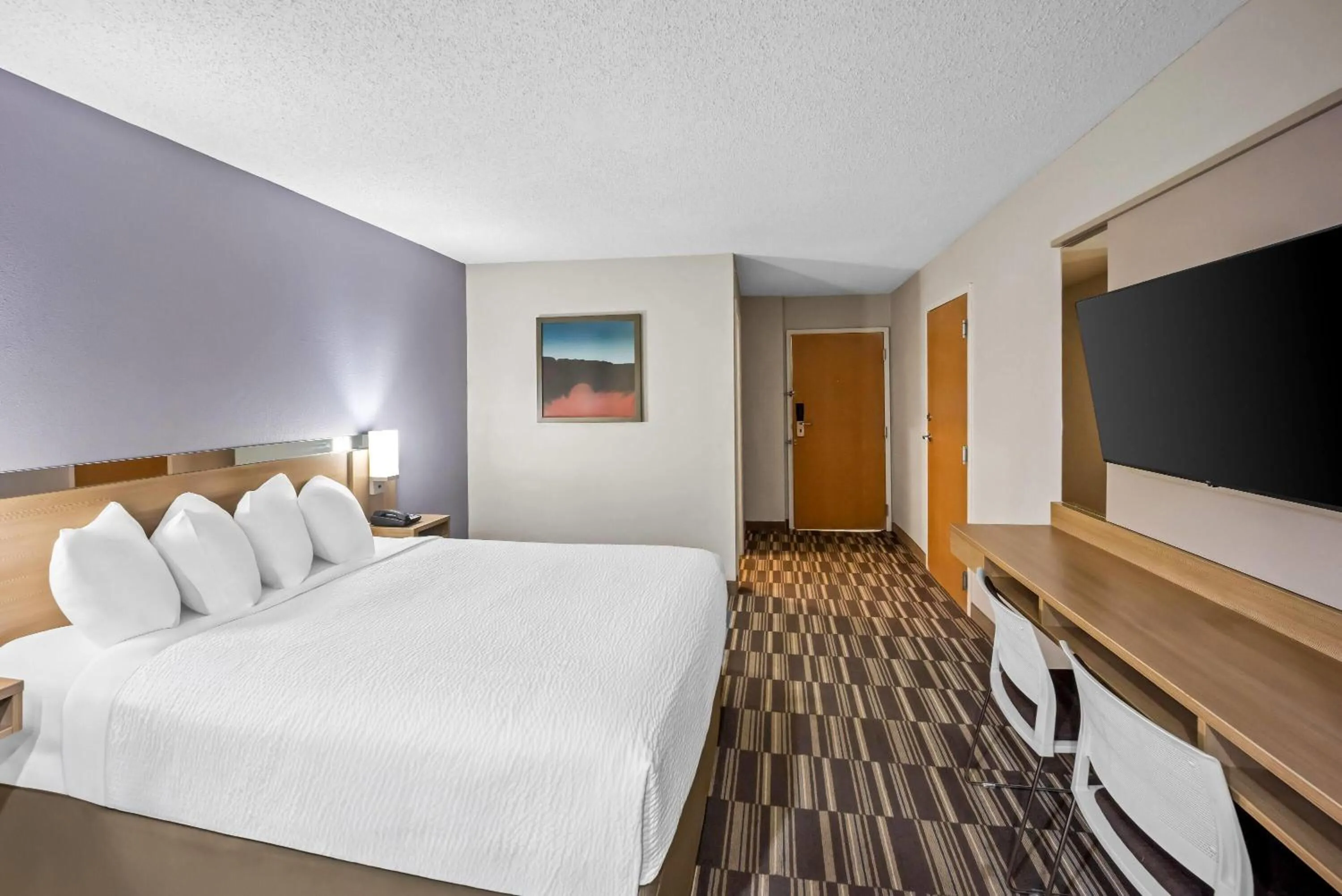 Bed in Microtel Inn by Wyndham Greensboro