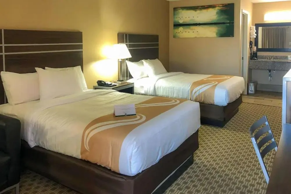 Bed in Quality Inn Madisonville
