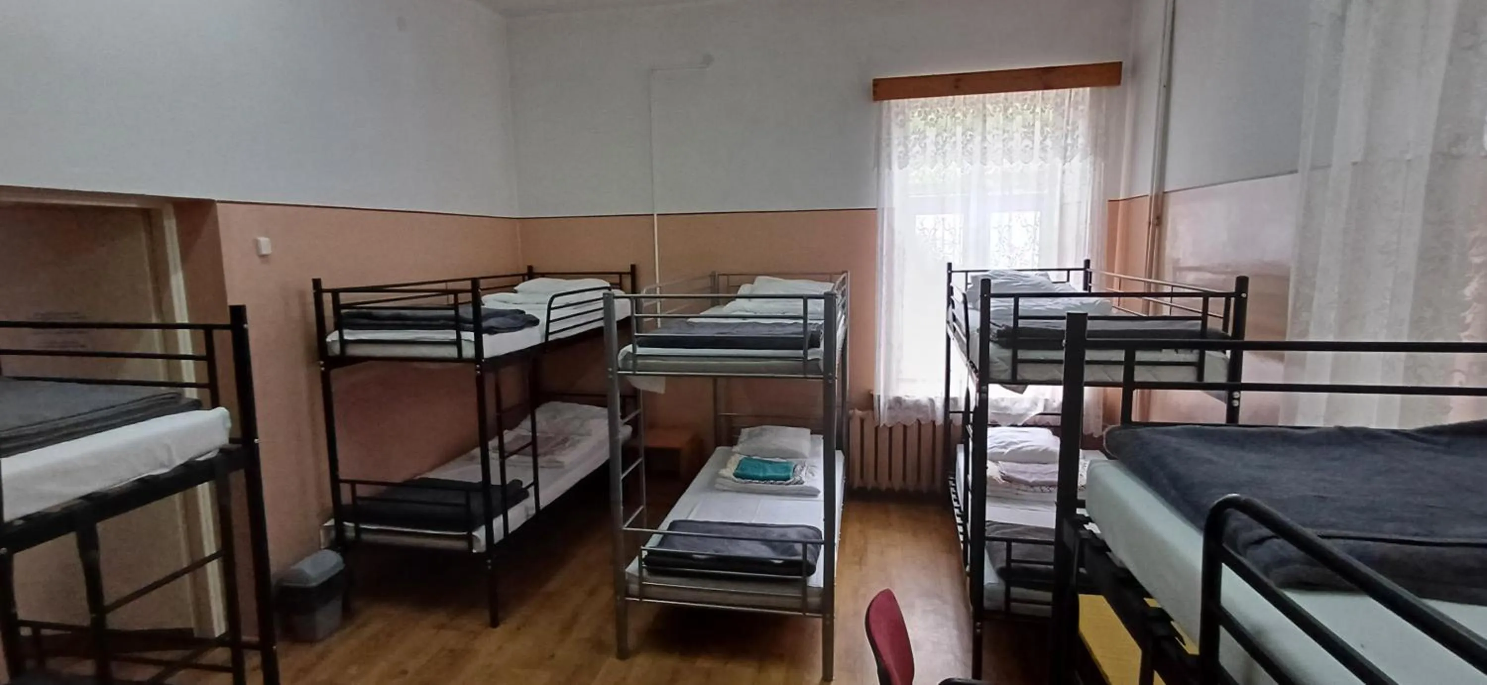 Photo of the whole room, Bed in Schronisko Młodzieżowe PTSM Matecznik