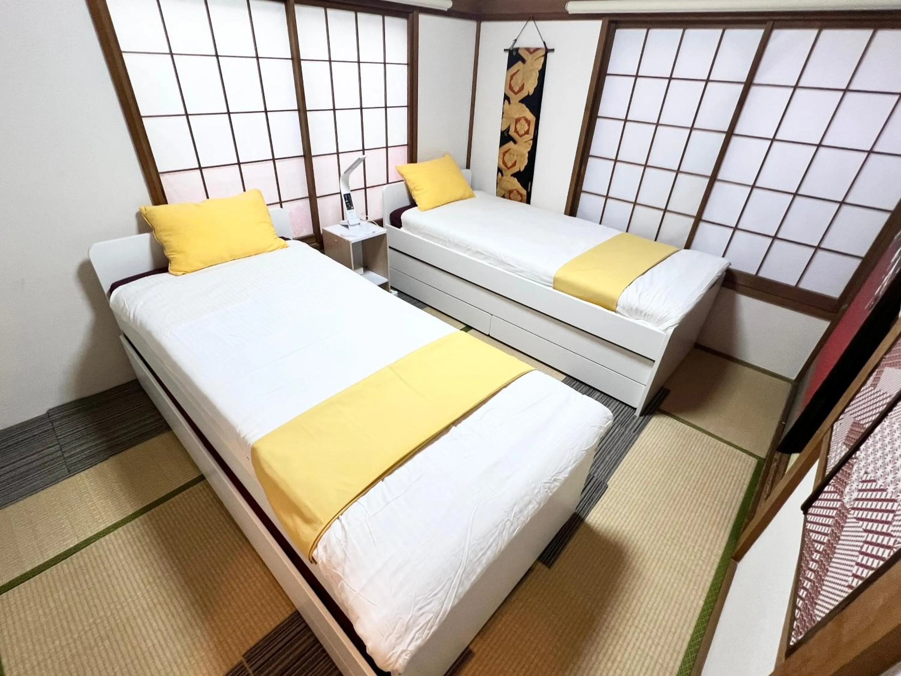Bed in Ikebukuro no Yado detached house