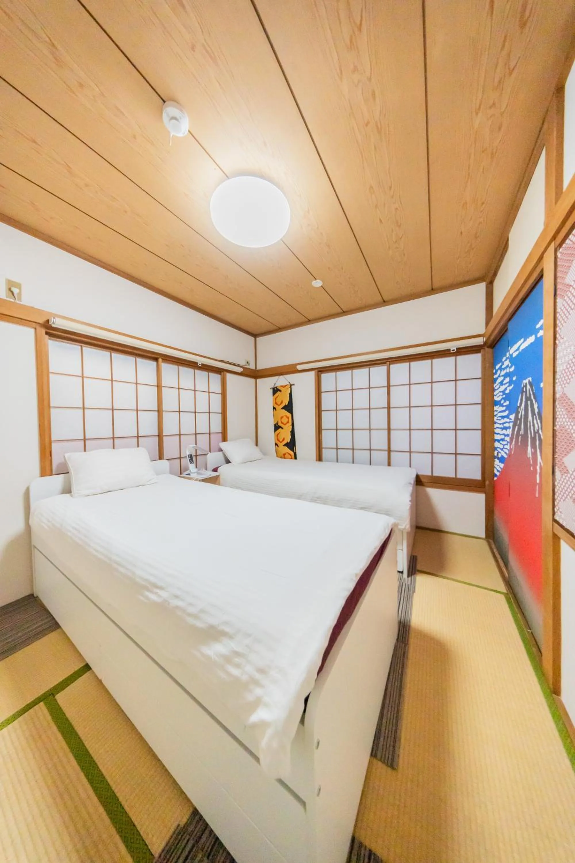 Bed in Ikebukuro no Yado detached house