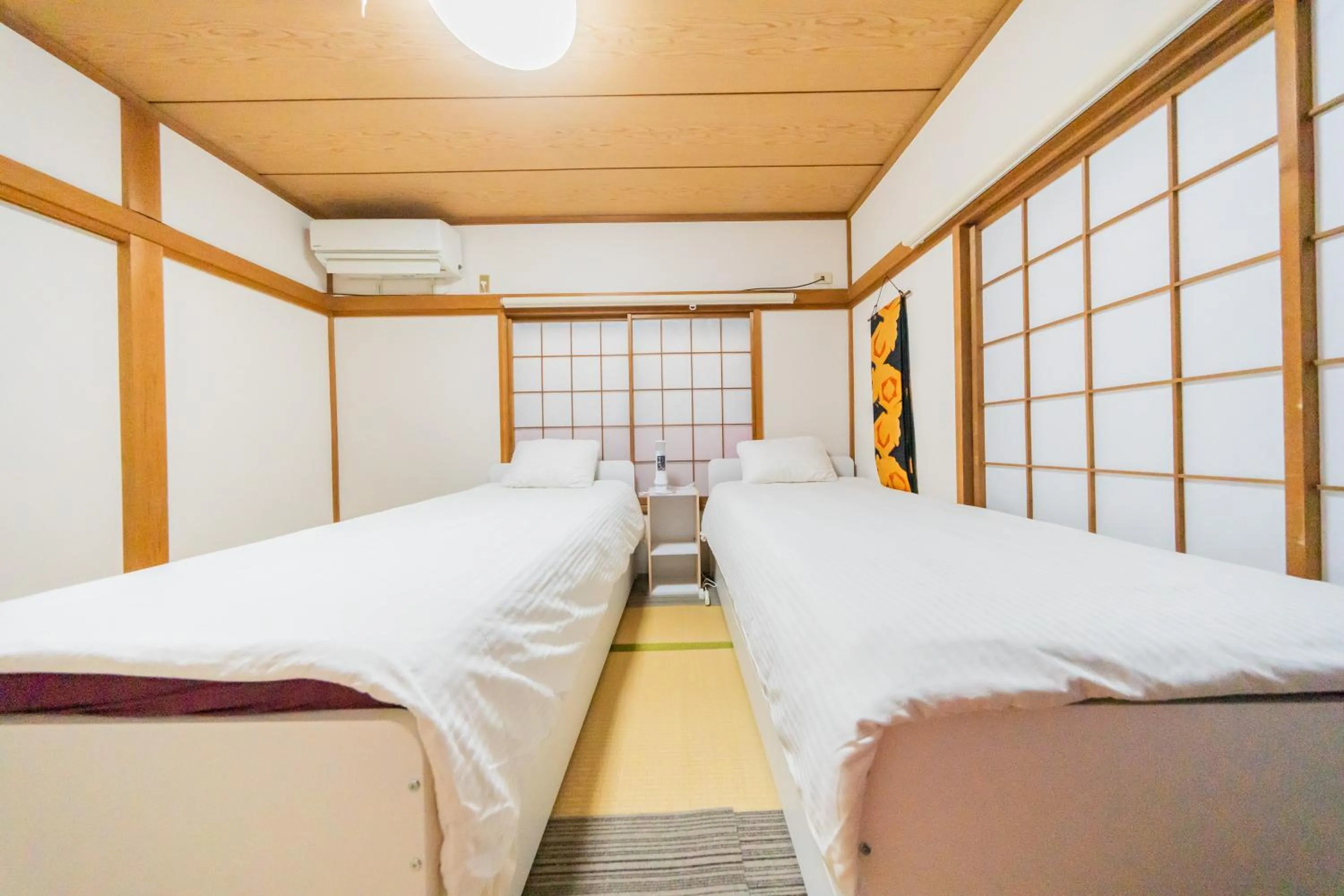 Bed in Ikebukuro no Yado detached house
