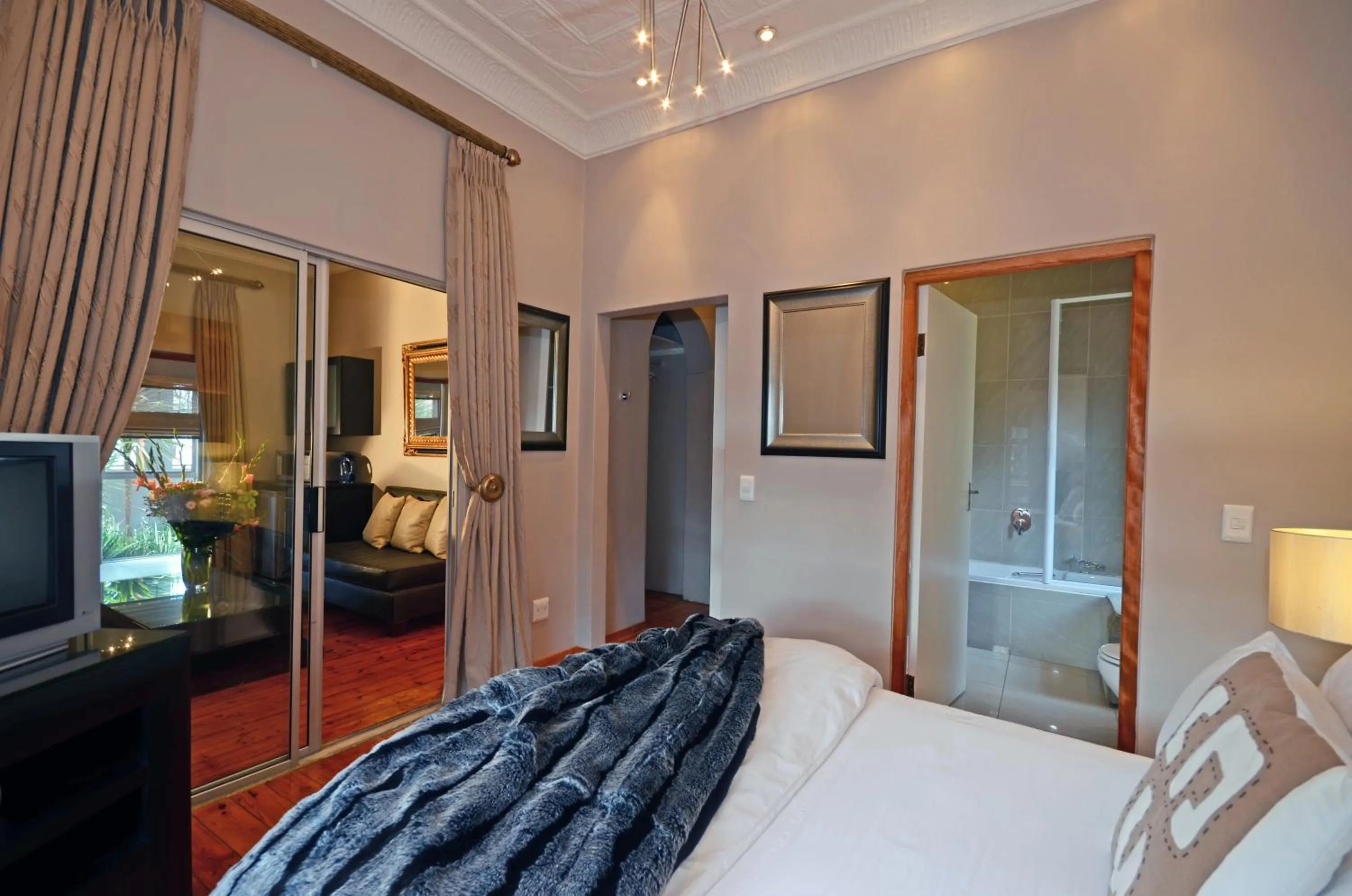 Seating area, Bed in Saffron Guest House