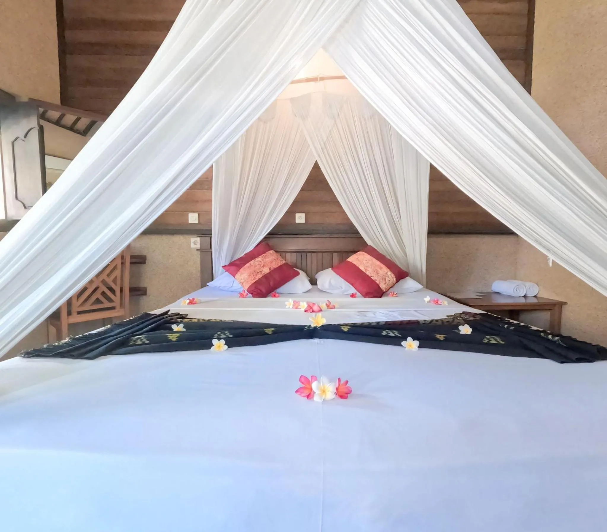 Bed in Suka Sari Cottages