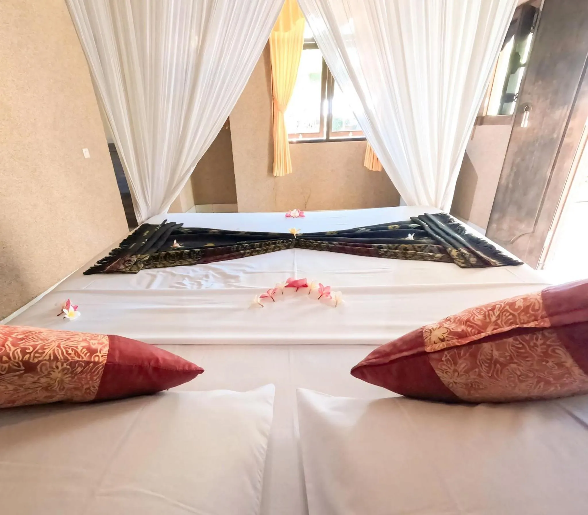 Bed in Suka Sari Cottages