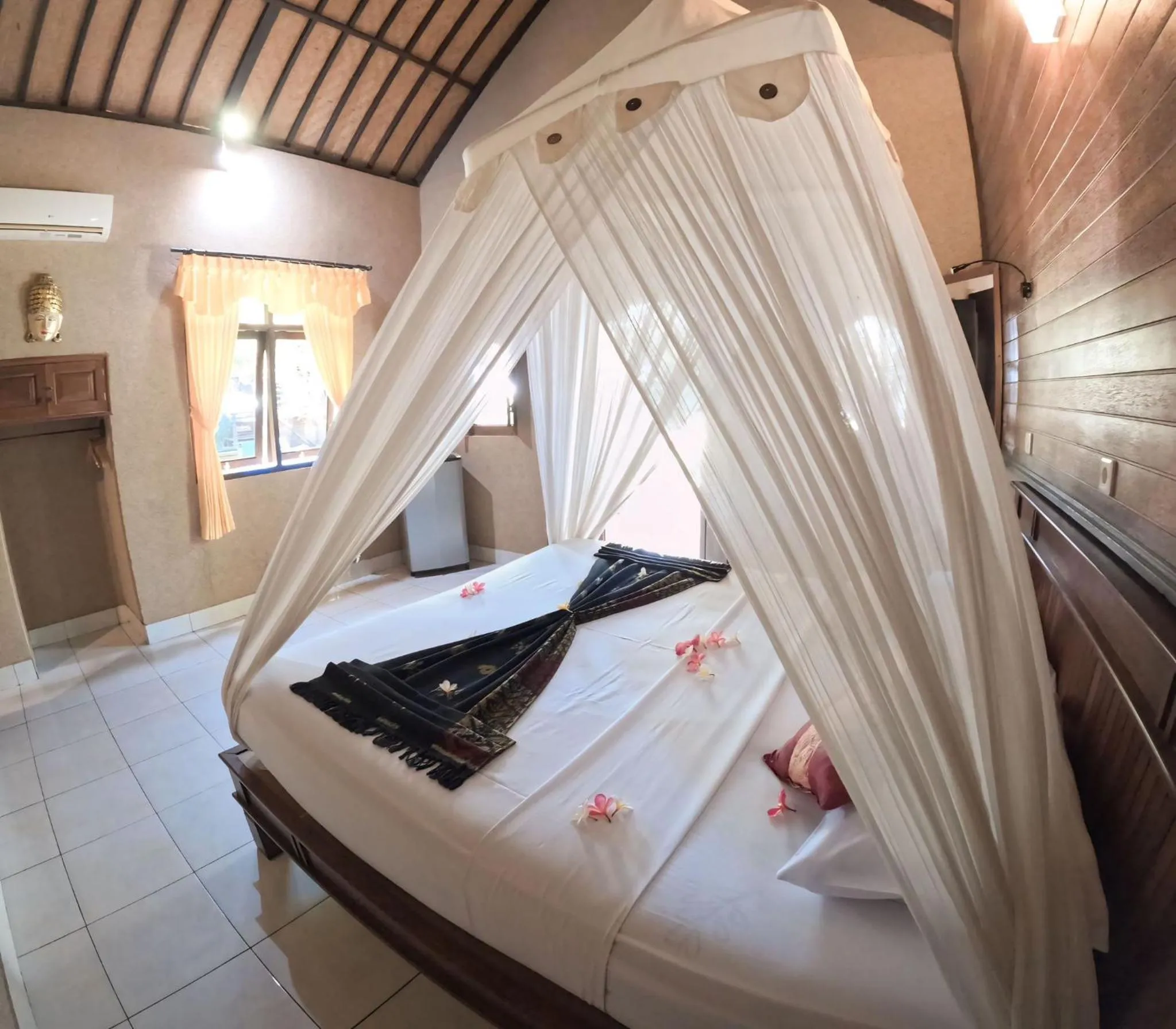 Bed in Suka Sari Cottages