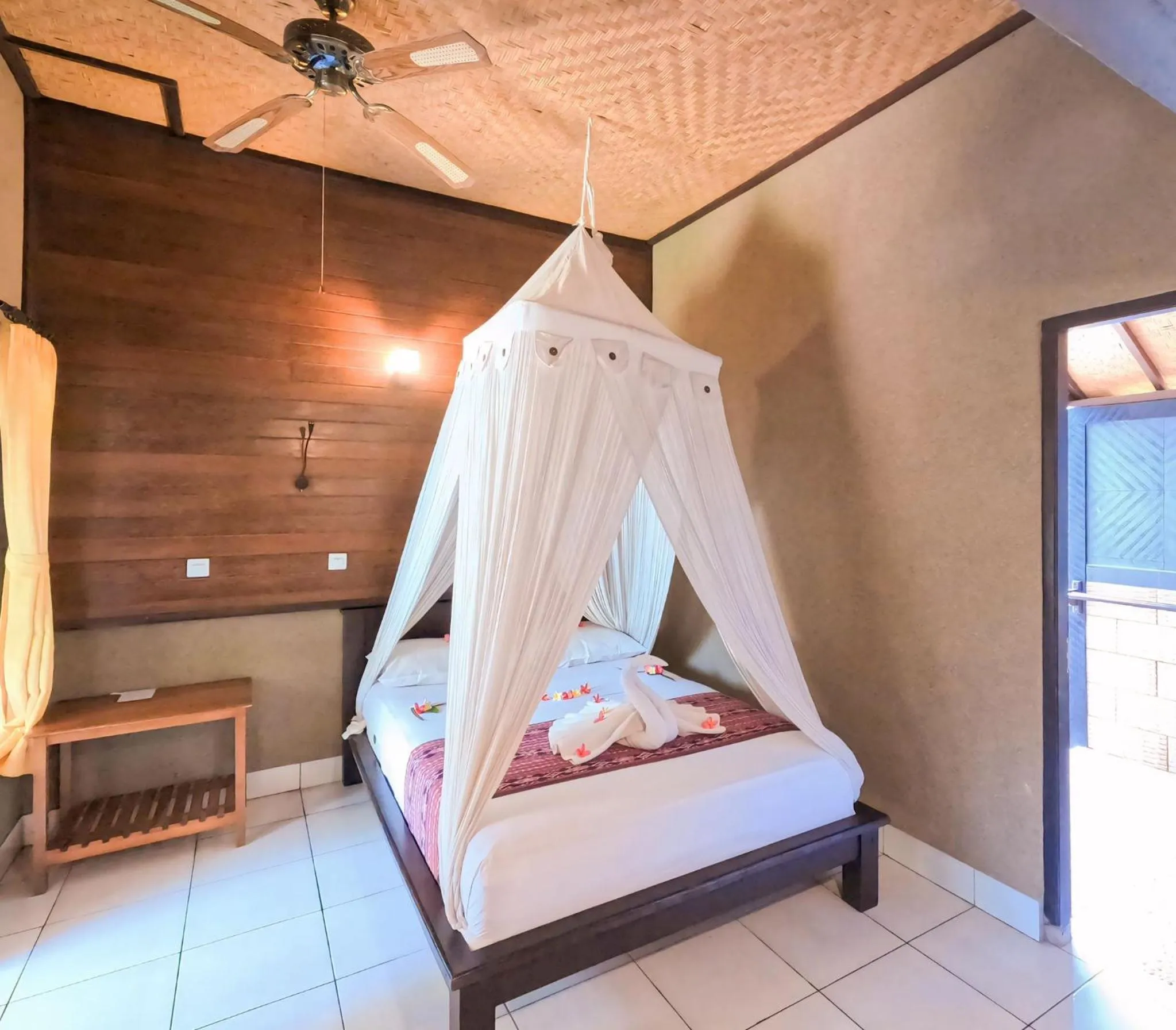 Bed in Suka Sari Cottages