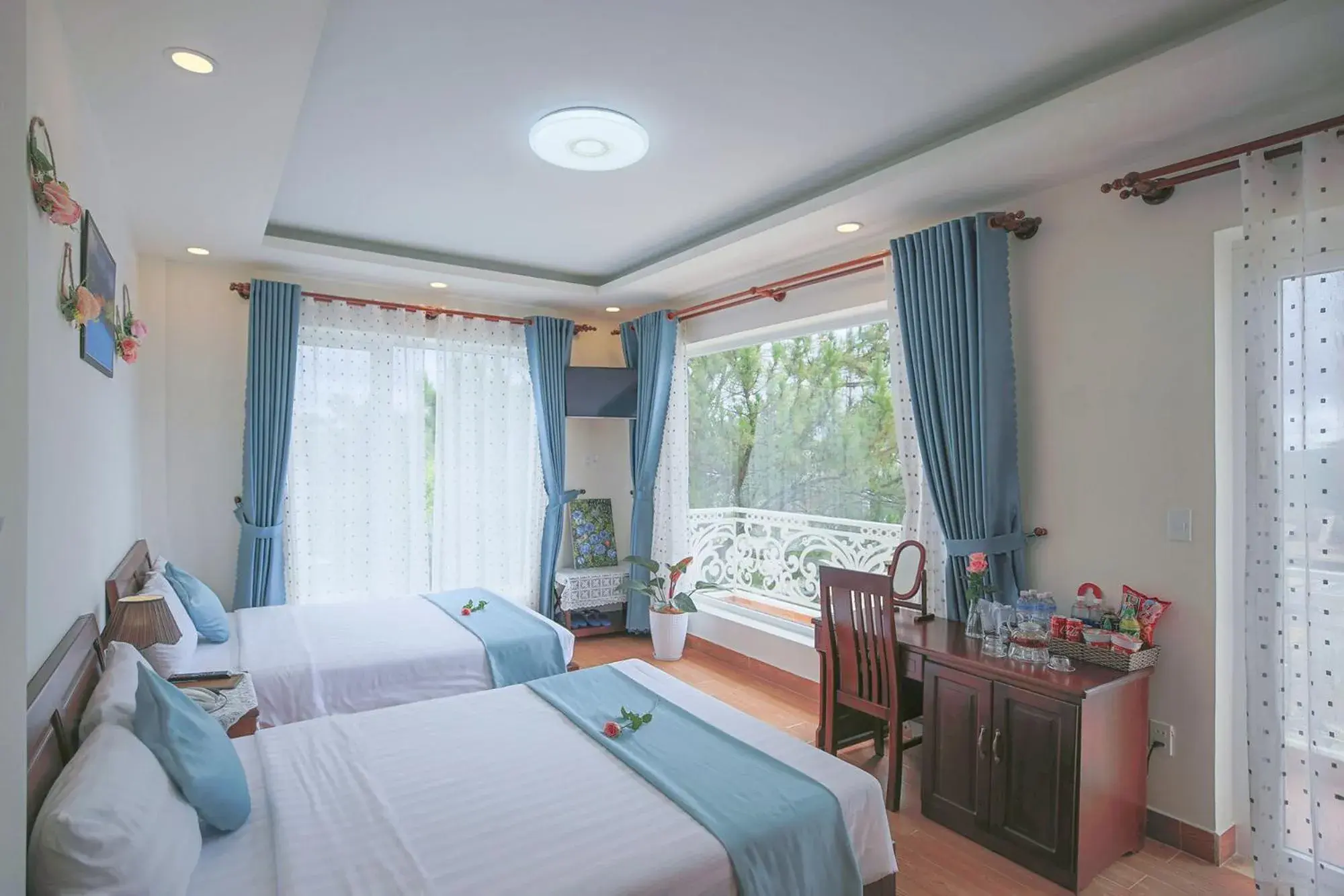 Quadruple Room with Balcony in Rose Valley Hotel Da Lat Vietnam Quadruple Room with Balcony in Rose Valley Hotel Da Lat Vietnam