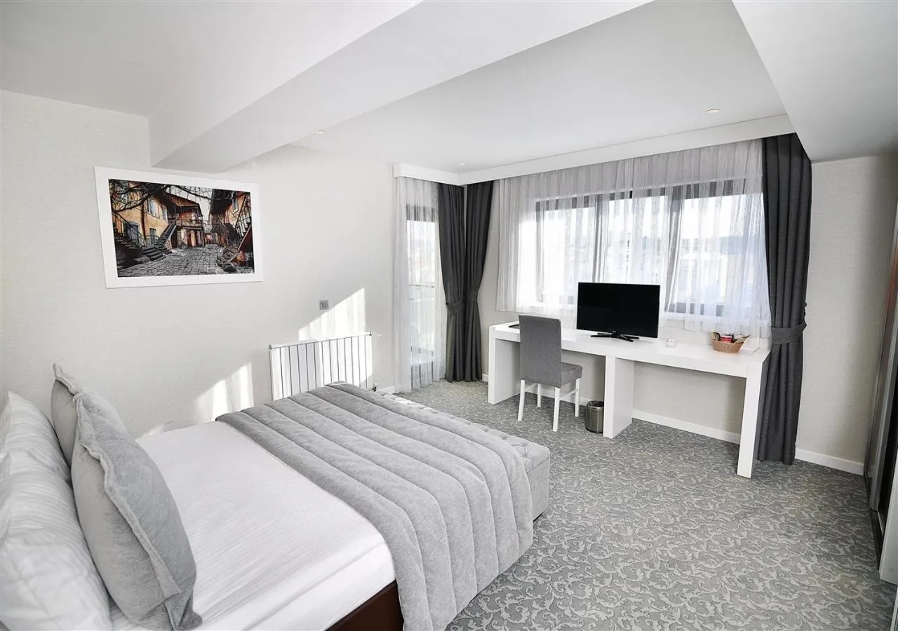 Bedroom in SVEO Business Hotel