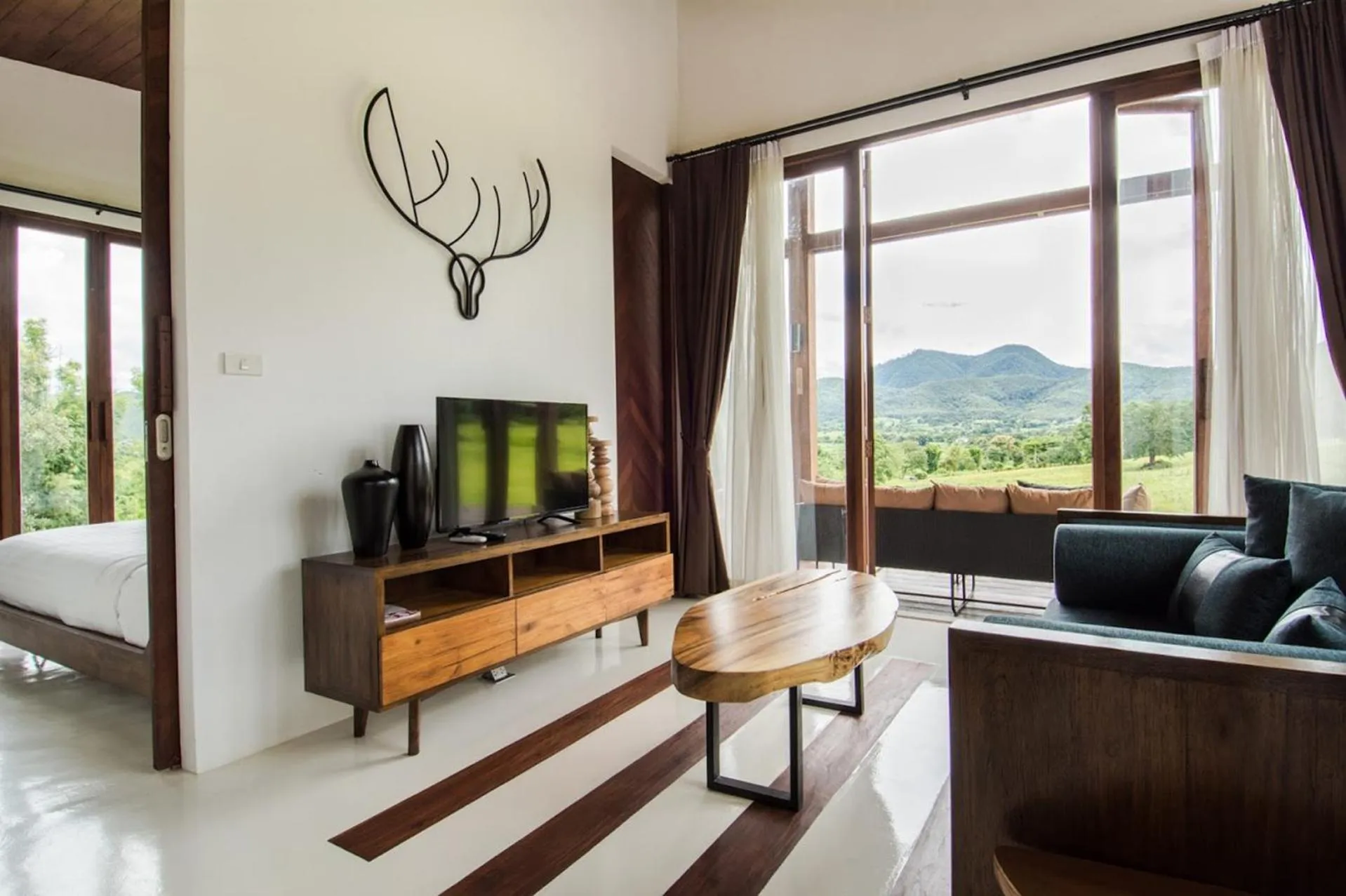 Living room, Bed in Puripai Villa Wellness & Retreat