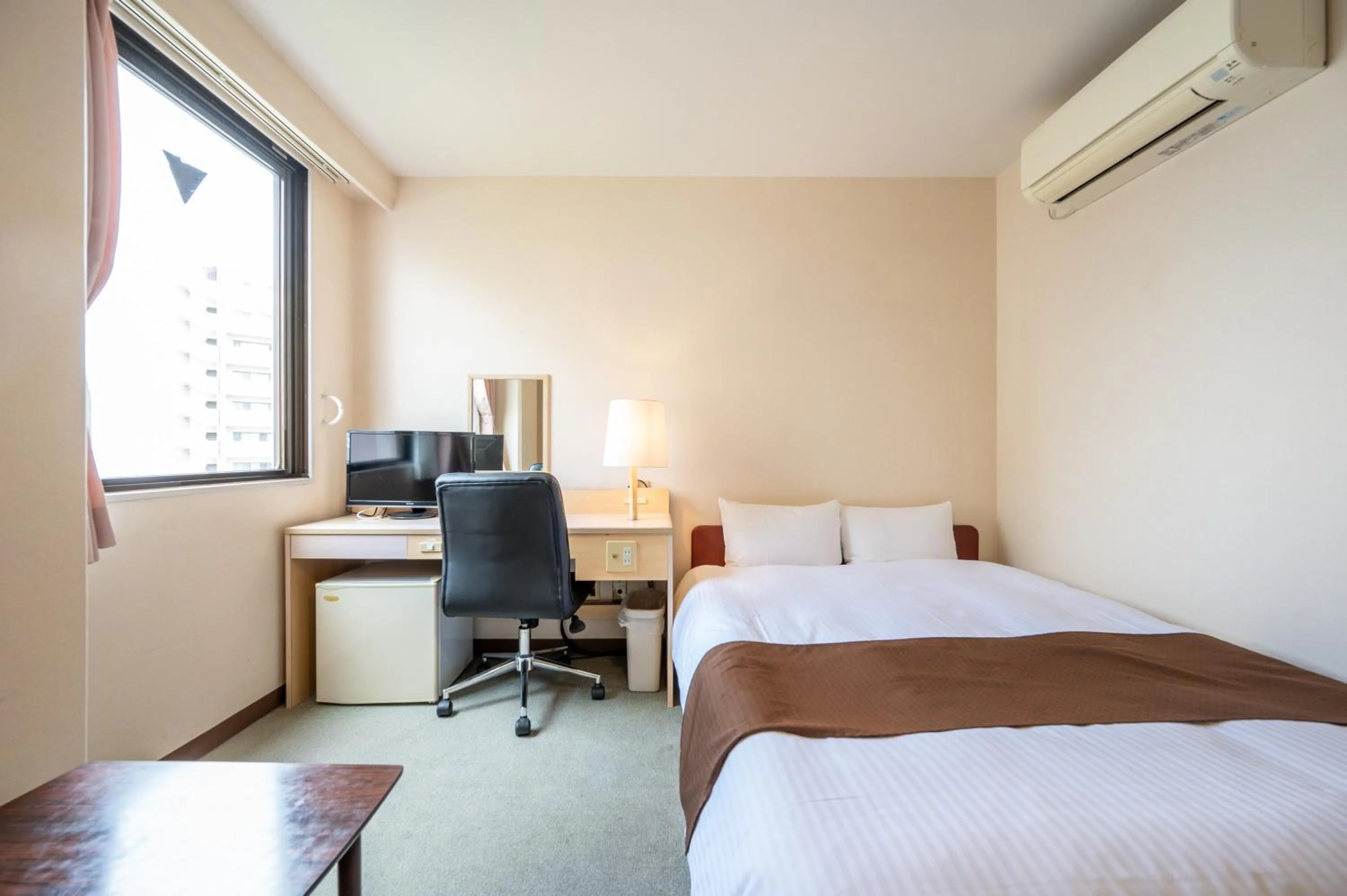 Bed in Kagoshima Daiichi Hotel Kamoike