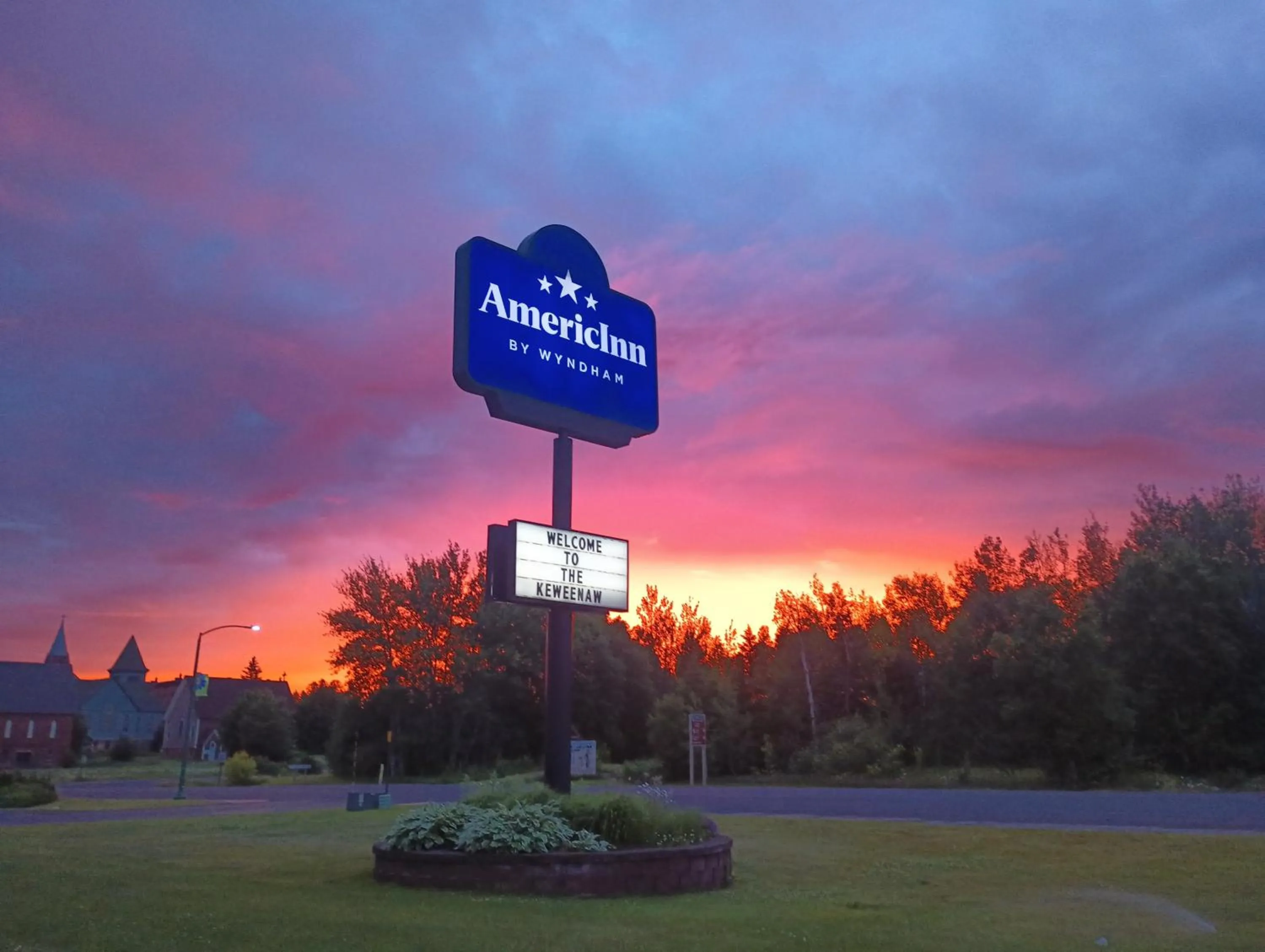 Property logo or sign in AmericInn by Wyndham Calumet