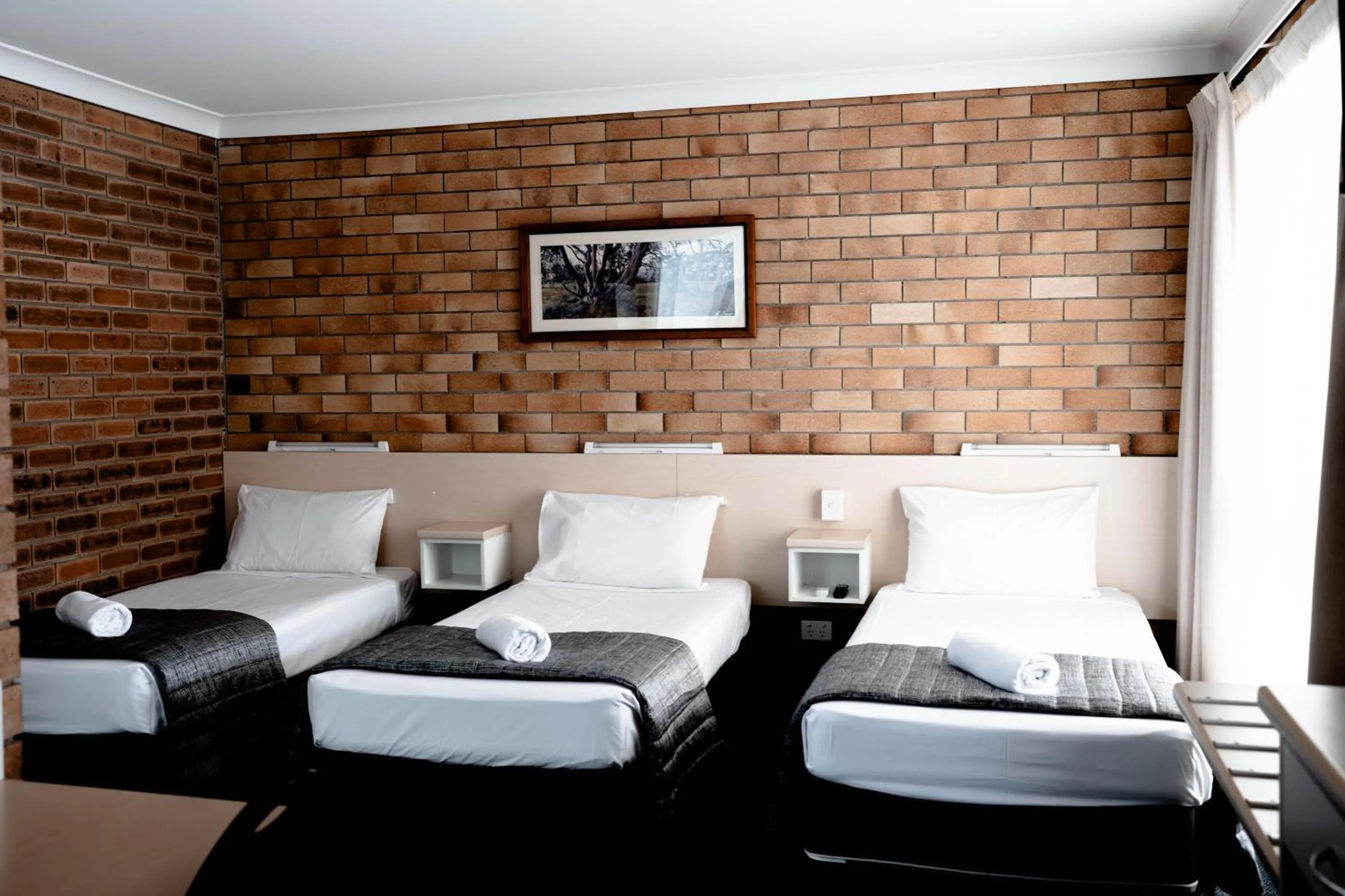 Bed in Buckaroo Motor Inn