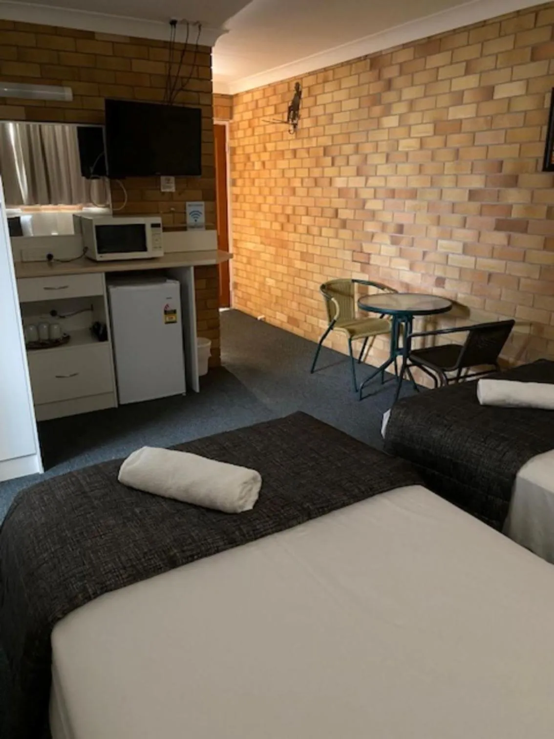 Bed in Buckaroo Motor Inn