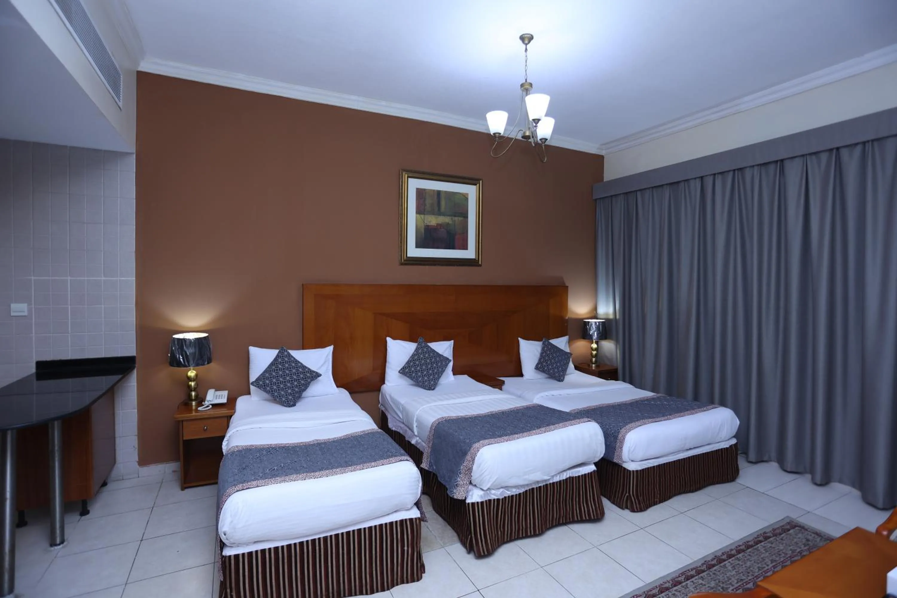 Bed in Icon Hotel Apartments