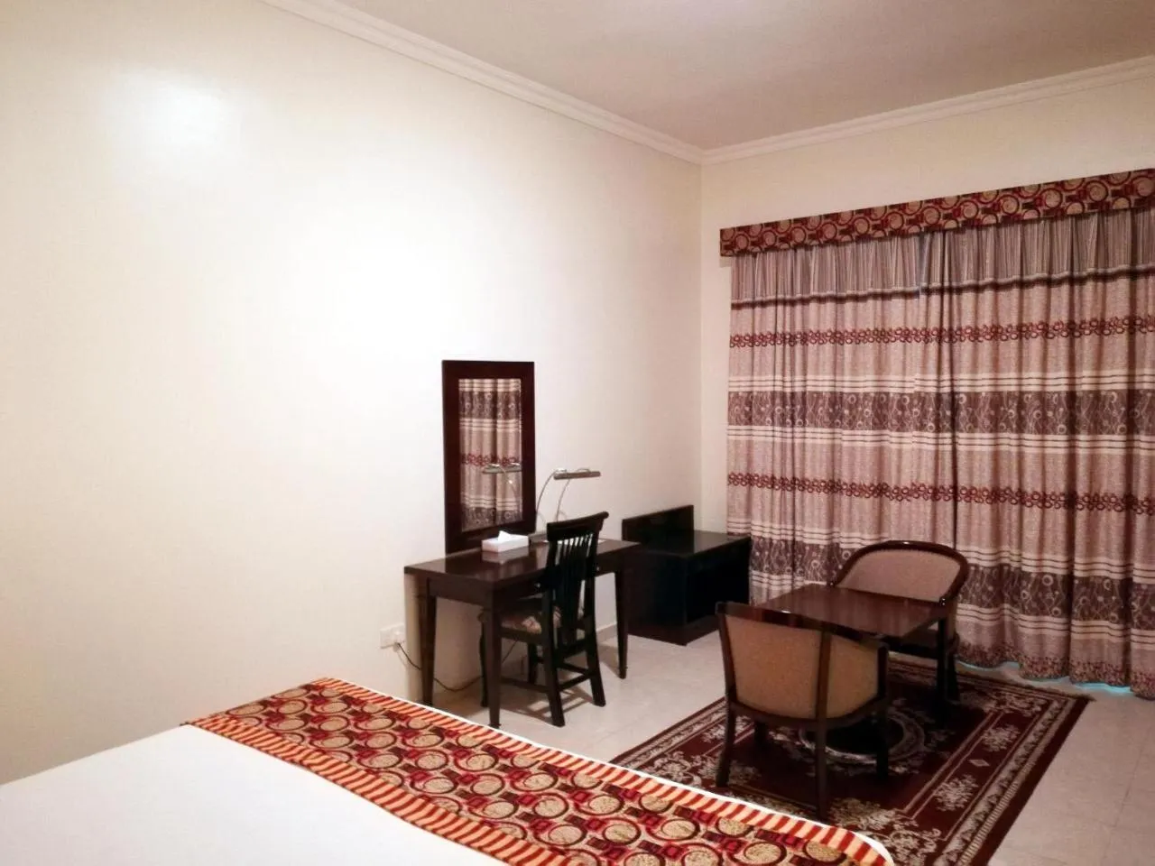 Bed in Icon Hotel Apartments