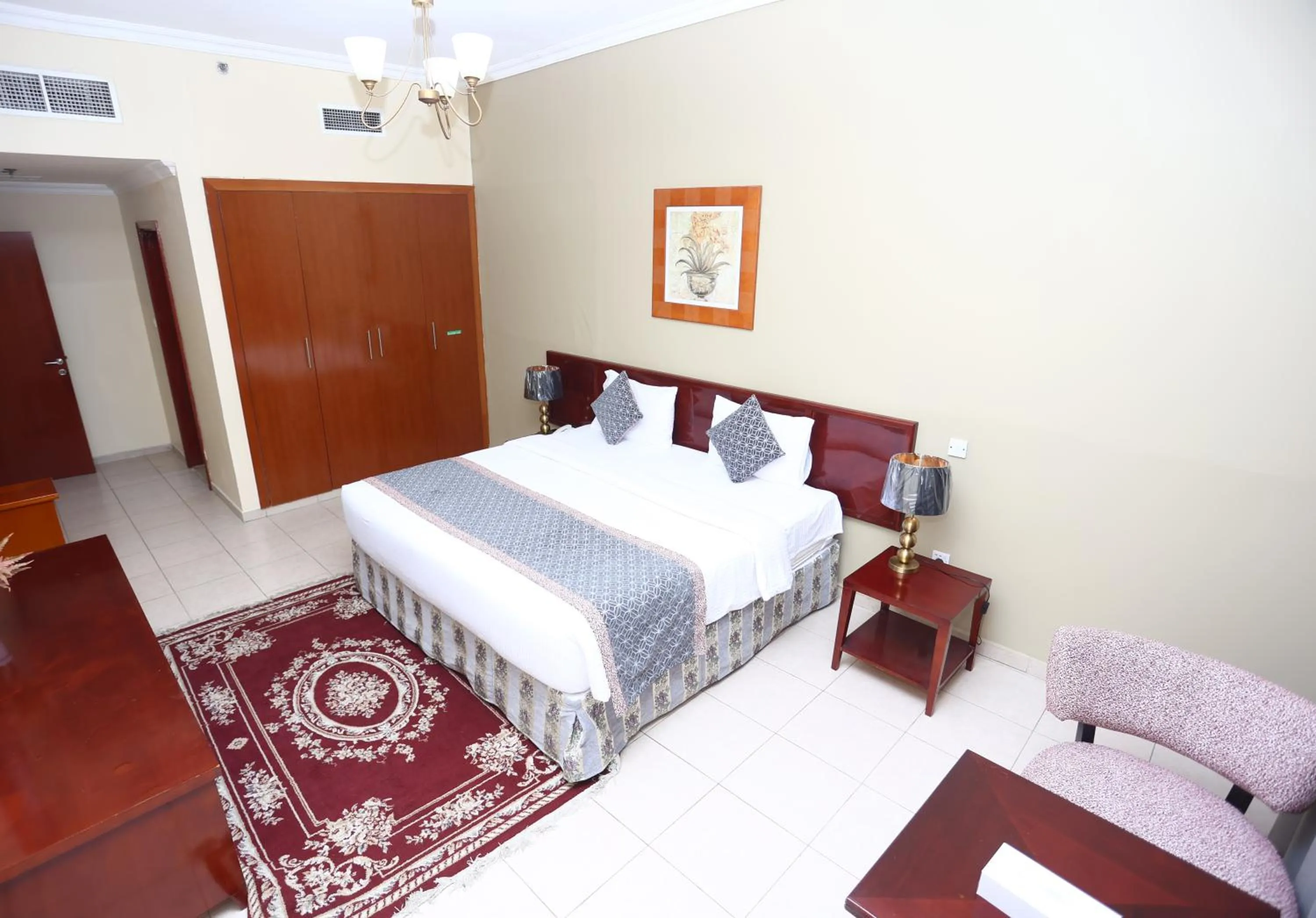 Bed in Icon Hotel Apartments