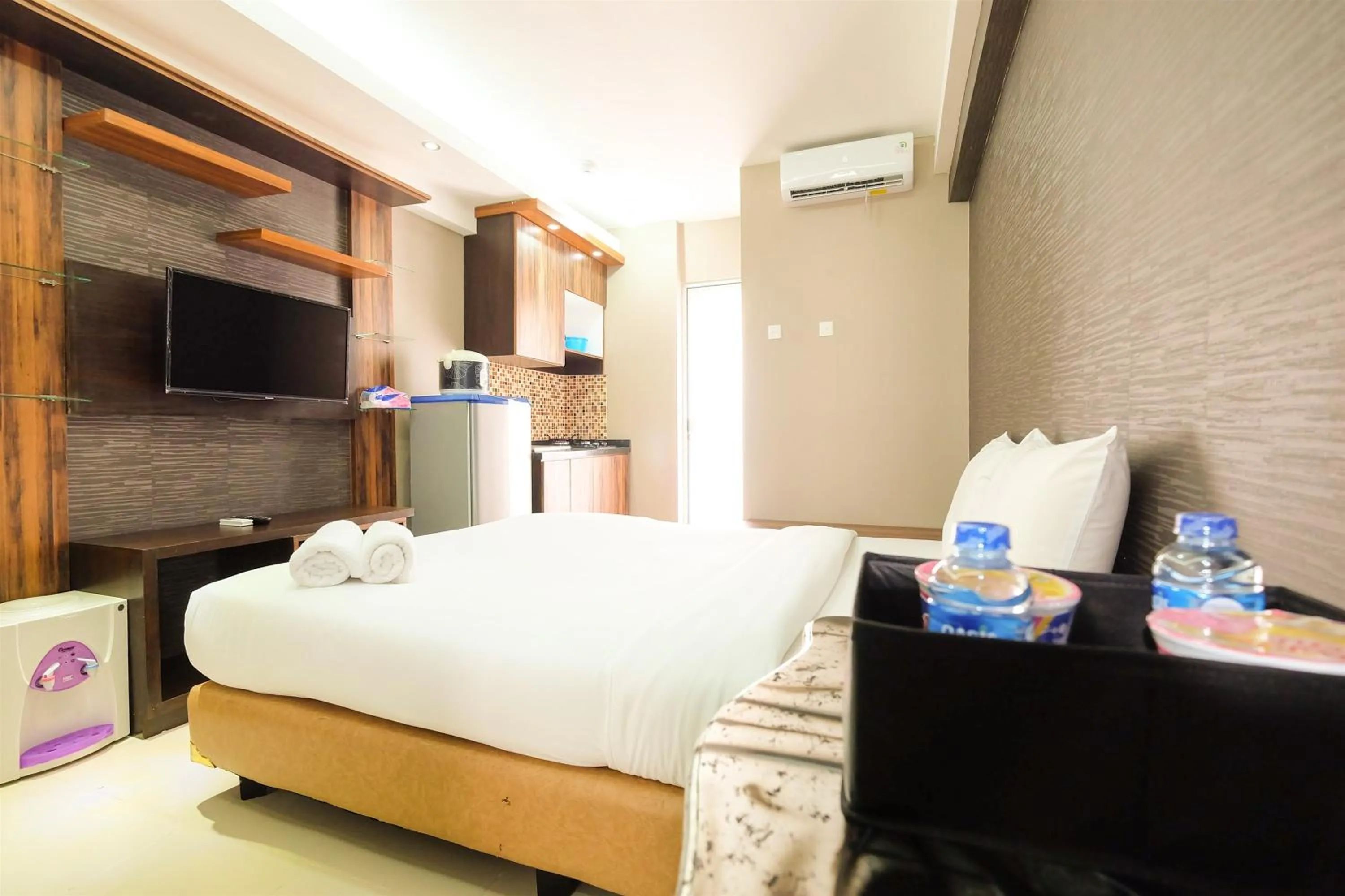 Bed in Simple Studio Bassura City Apartment By Travelio