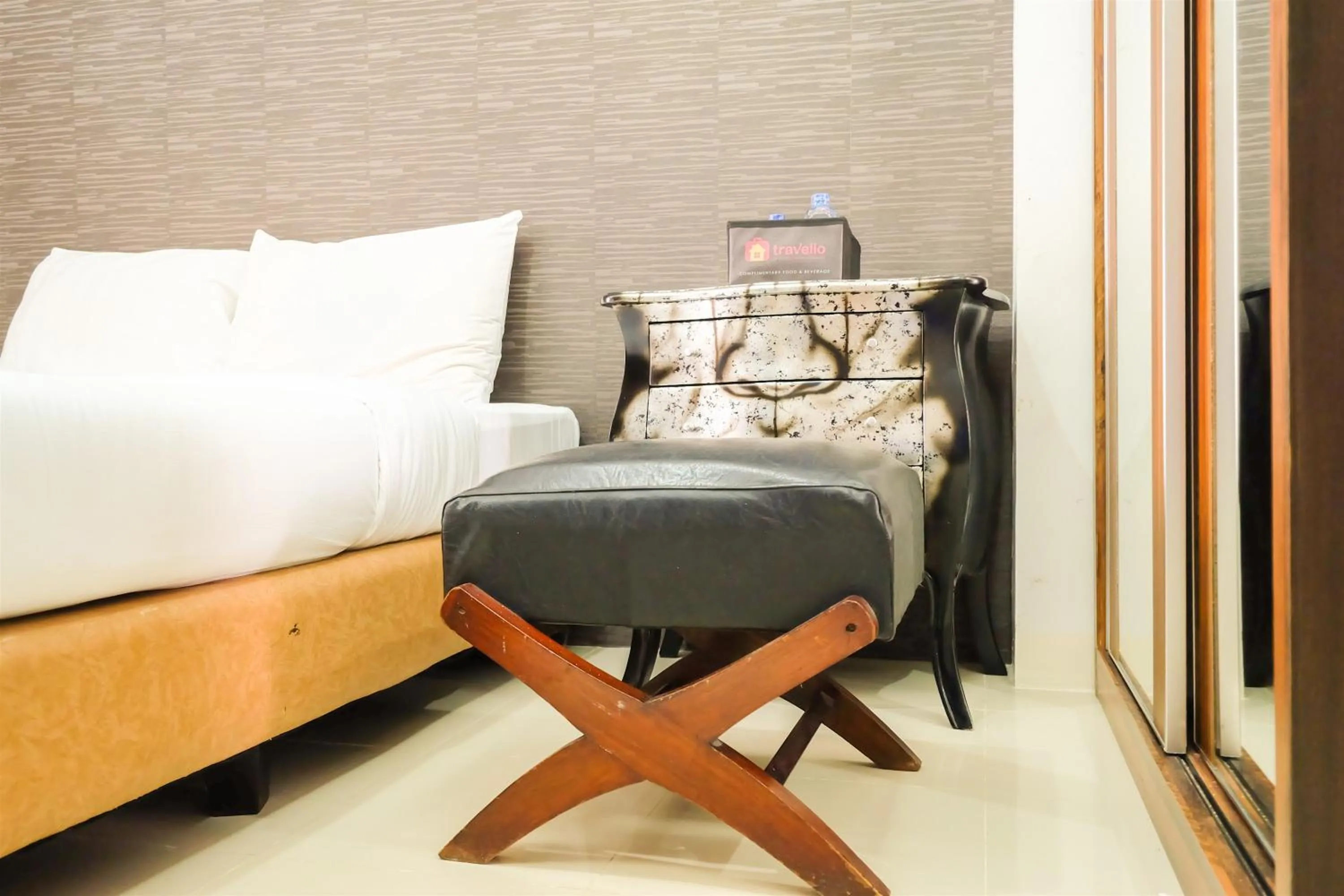 Bed in Simple Studio Bassura City Apartment By Travelio