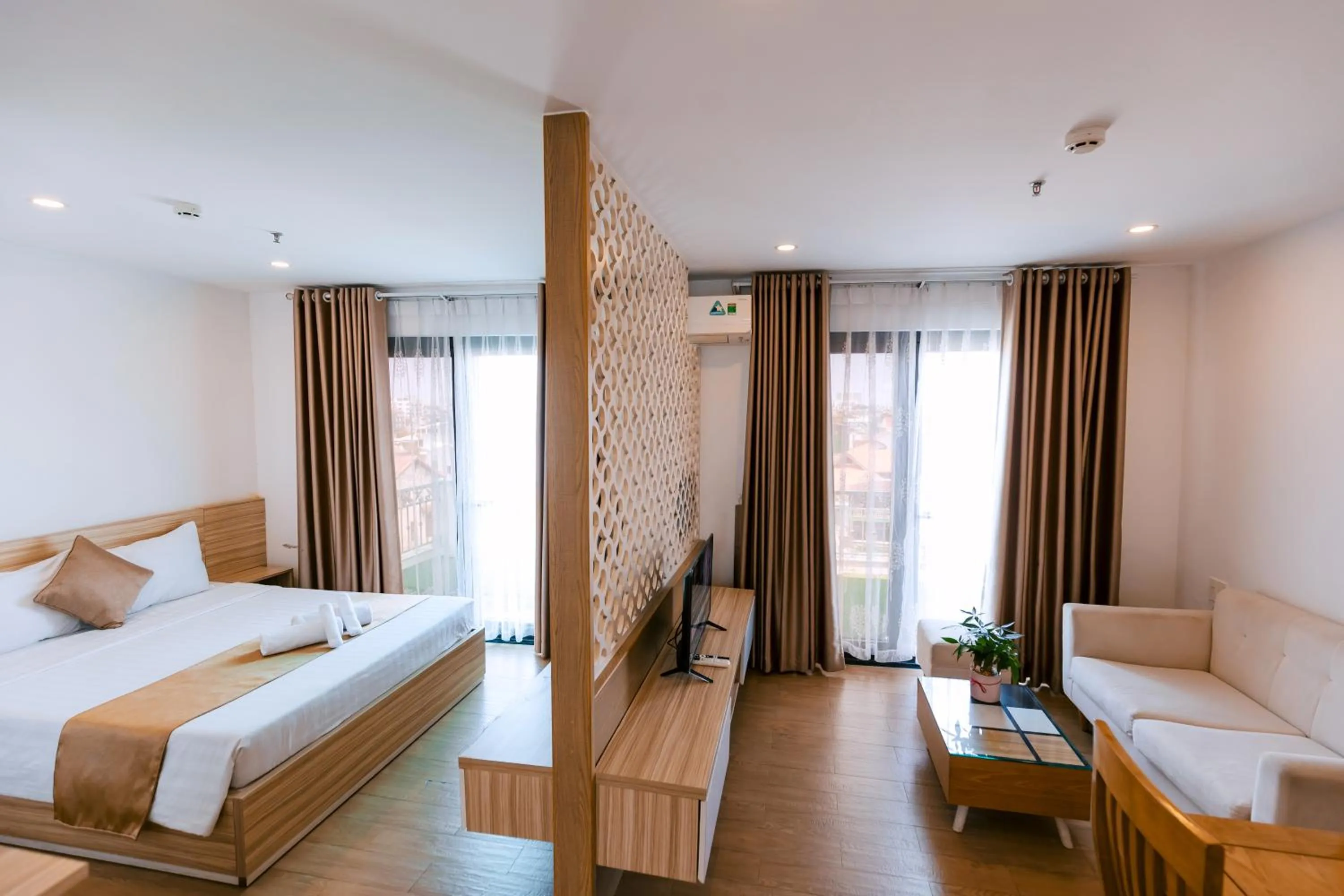 Living room, Bed in Gardenia Hue Hotel